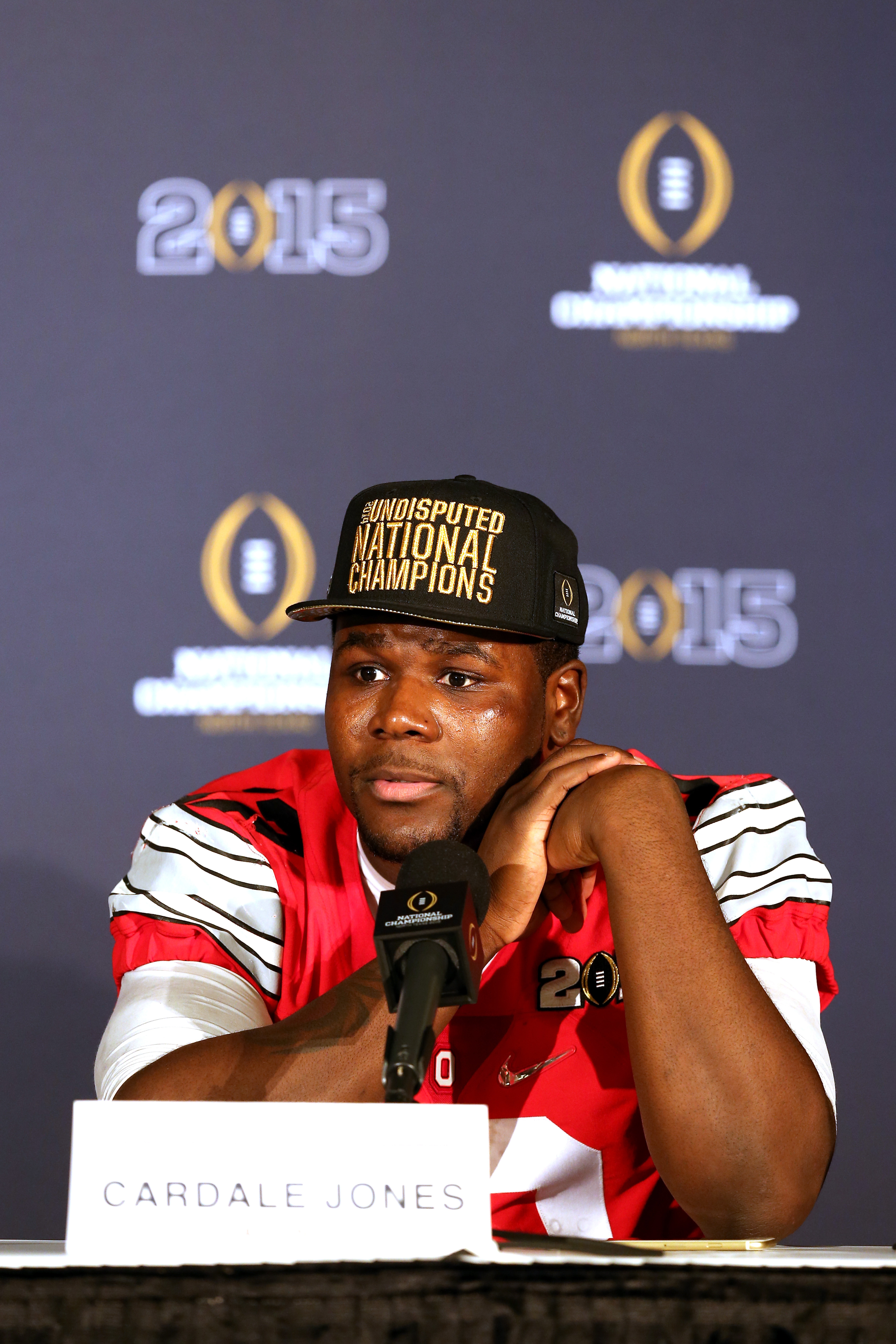 Quarterback Cardale Jones #12 of the Ohio State Buckeyes talks to the media after defeating the Oregon Ducks in the College Football Playoff National Championship Game at AT&amp;T Stadium on January 12, 2015 in Arlington, Texas.  The Ohio State Buckeyes defeated the Oregon Ducks 42 to 20. (Sarah Glenn&mdash;Getty Images)