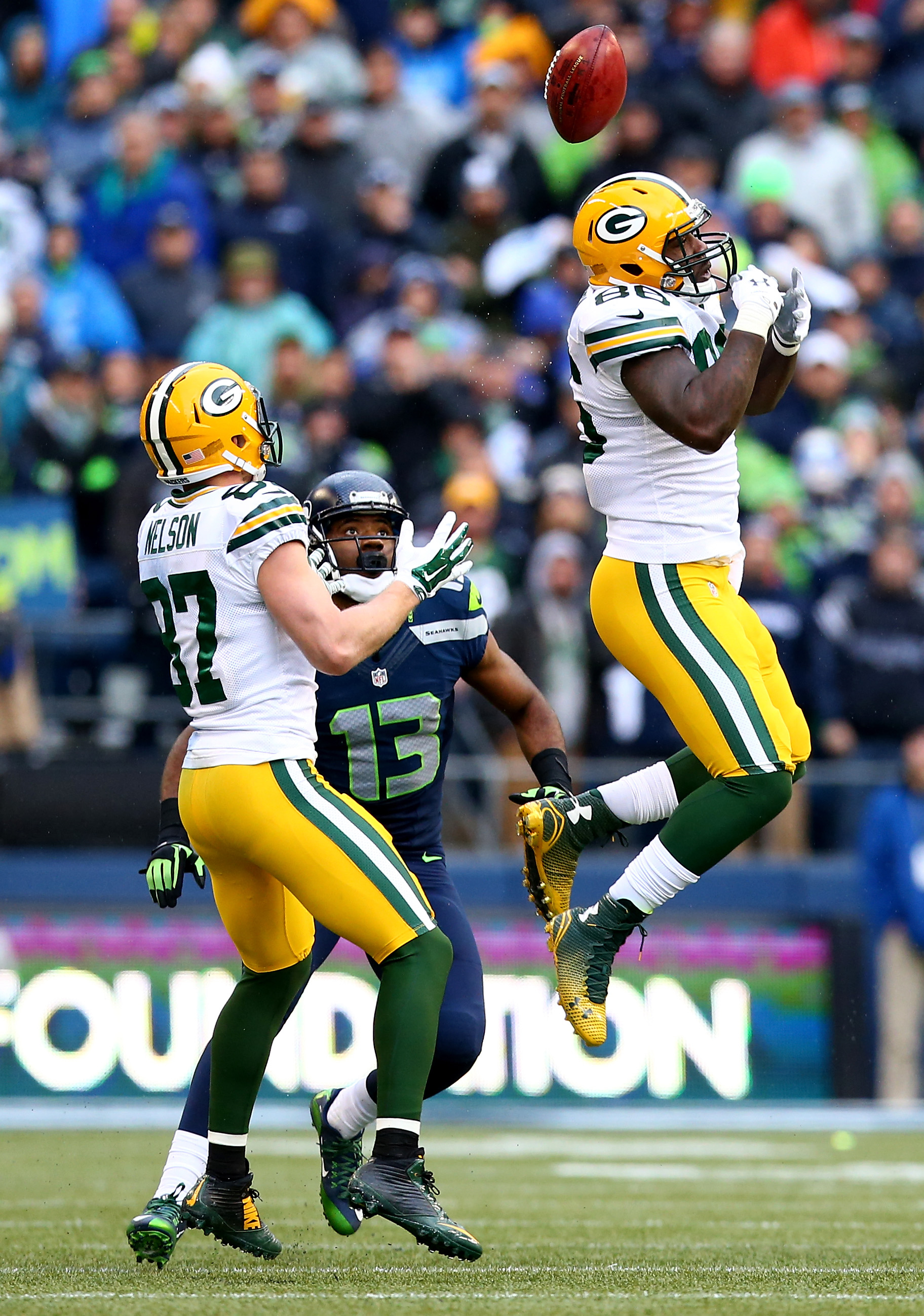 Brandon Bostick of the Green Bay Packers (right) bobbles an onsides kick as during the fourth quarter of the 2015 NFC Championship game at CenturyLink Field on January 18, 2015 in Seattle, Washington. (Ronald Martinez&mdash;Getty Images)
