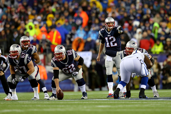 Tom Brady of the New England Patriots gestures before a snap against the Indianapolis Colts at Gillette Stadium in Foxboro, Mass., on Jan. 18, 2015 (Jim Rogash—Getty Images)