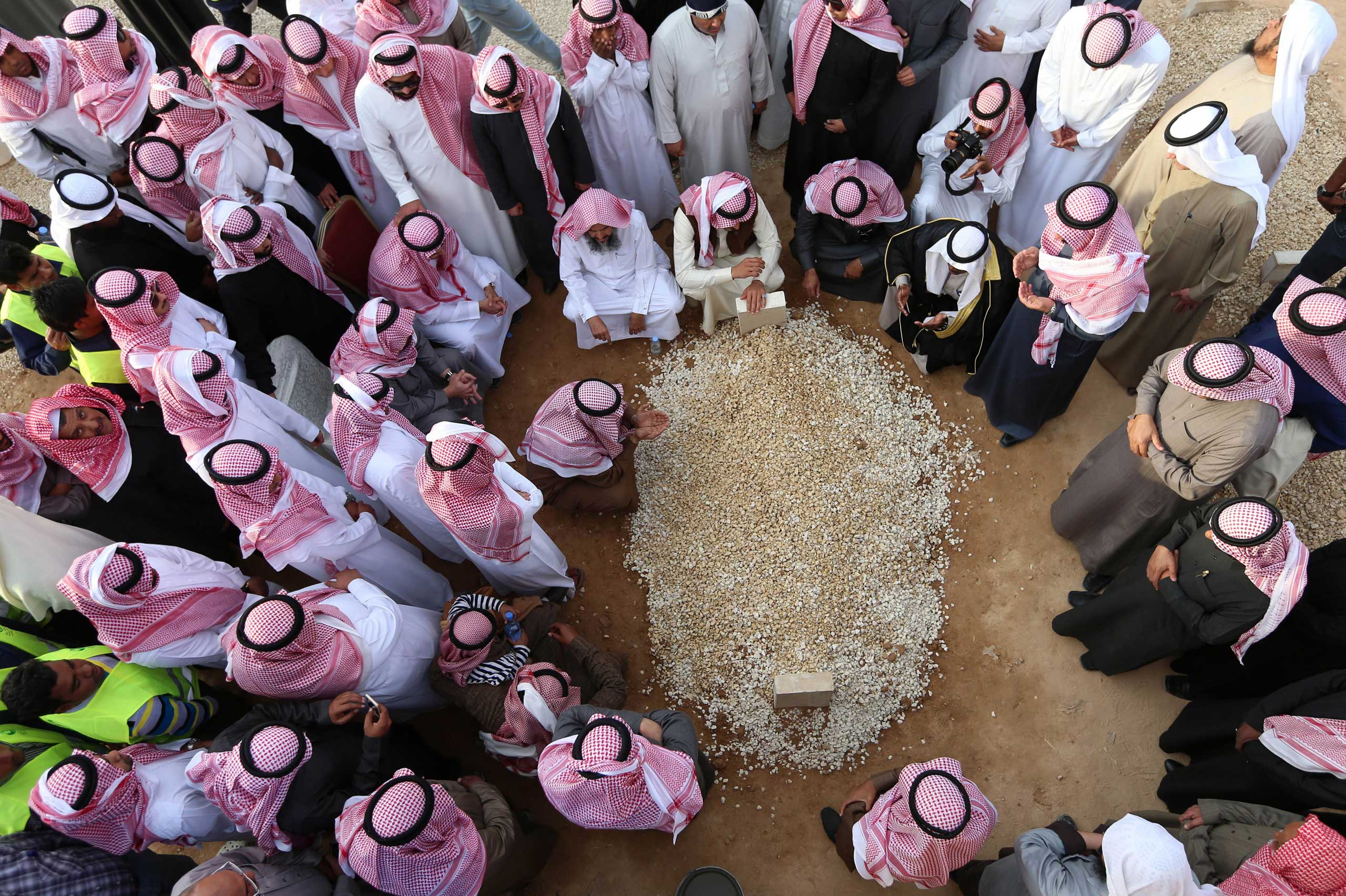 Jan. 23, 2015. Mourners gather around the grave of Saudi Arabia's King Abdullah at the Al-Oud cemetery in Riyadh following his death in the early hours of the morning.