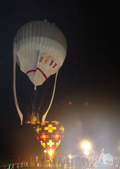 A hot-air balloon of the U.S. balloonist Troy Bradley and Russian Leonid Tiukhtyaev soars in Saga, Japan, on Jan. 25, 2015 (The Asahi Shimbun via Getty Images)