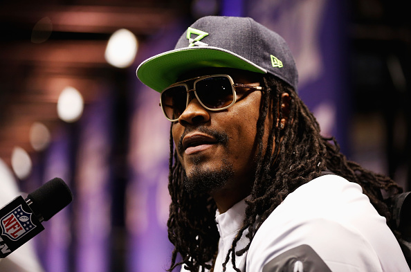 Marshawn Lynch of the Seattle Seahawks addresses the media at Super Bowl XLIX media day inside U.S. Airways Center in Phoenix on Jan. 27, 2015 (Christian Petersen—Getty Images)