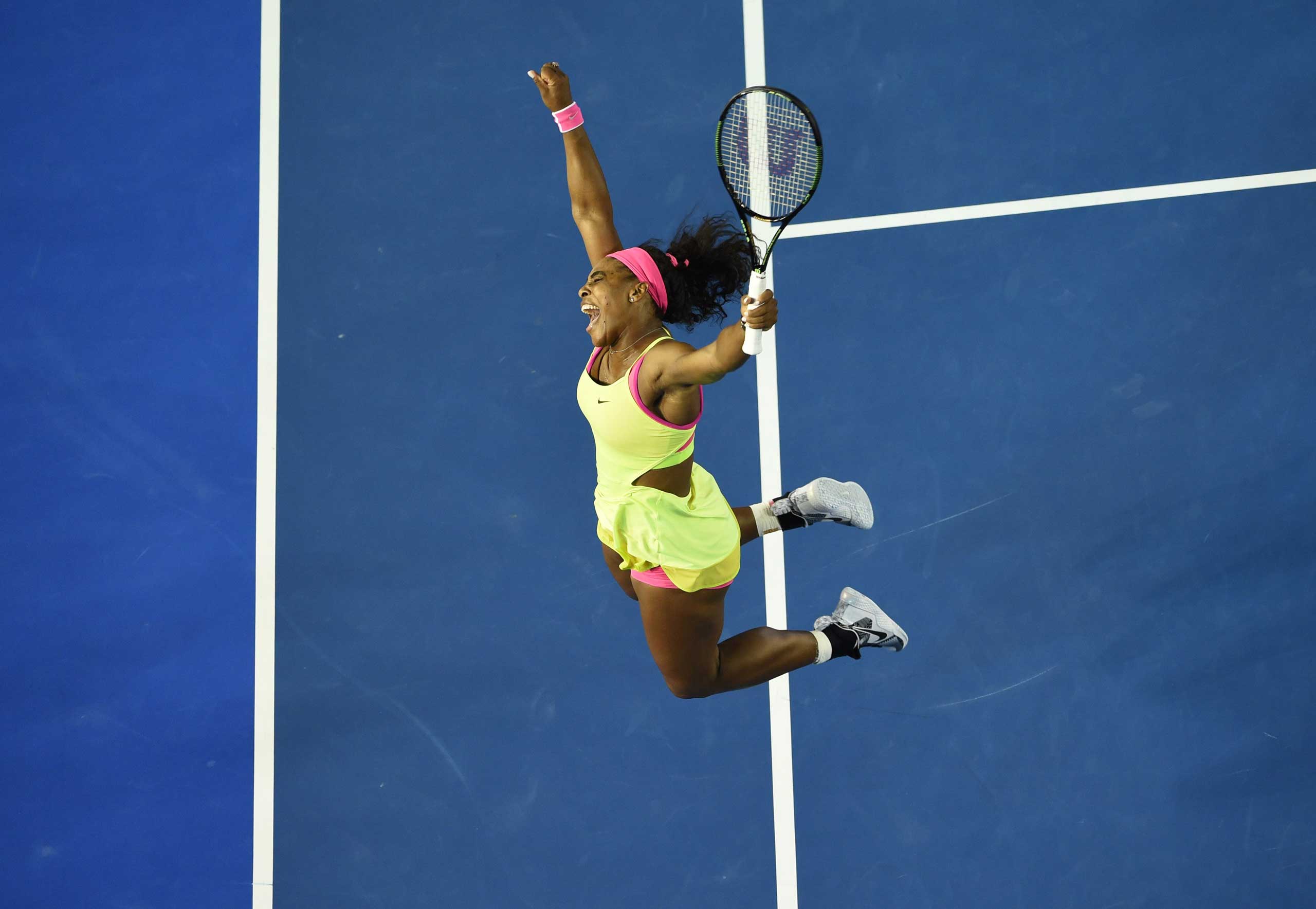 Serena Williams of the US celebrates after victory in her women's singles final match against Russia's Maria Sharapova on day thirteen of the 2015 Australian Open tennis tournament in Melbourne on Jan. 31, 2015. (William West—AFP/Getty Images)
