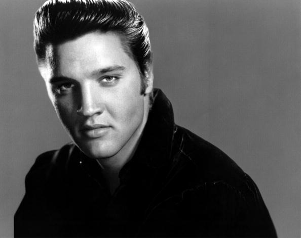 Posed studio portrait of Elvis Presley (RB—Redferns)
