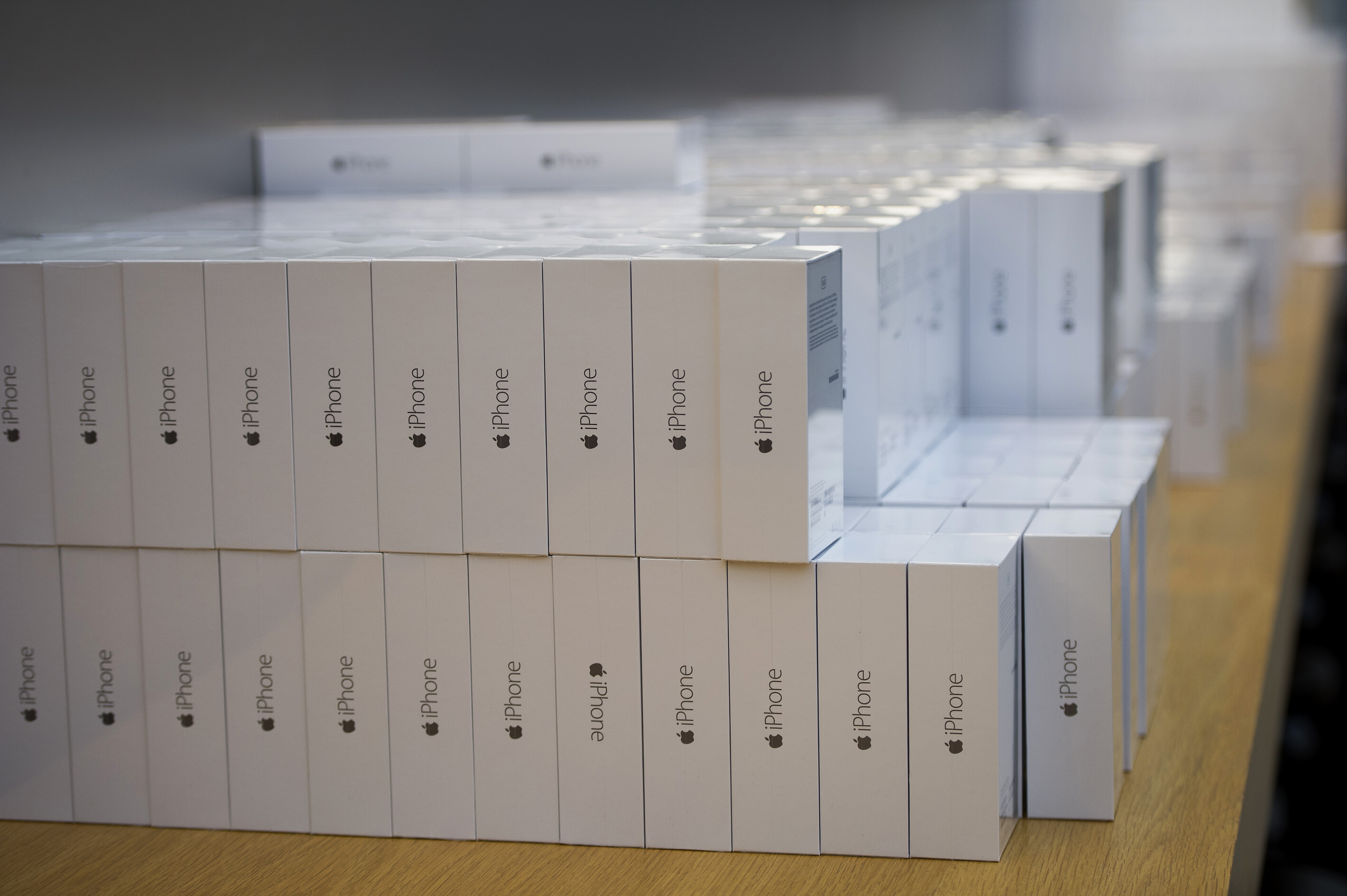 Boxes of iPhone 6 smartphones sit stacked on a counter during the sales launch at the Apple Inc. store in Palo Alto, Calif., on Sept. 19, 2014. (Bloomberg via Getty Images)