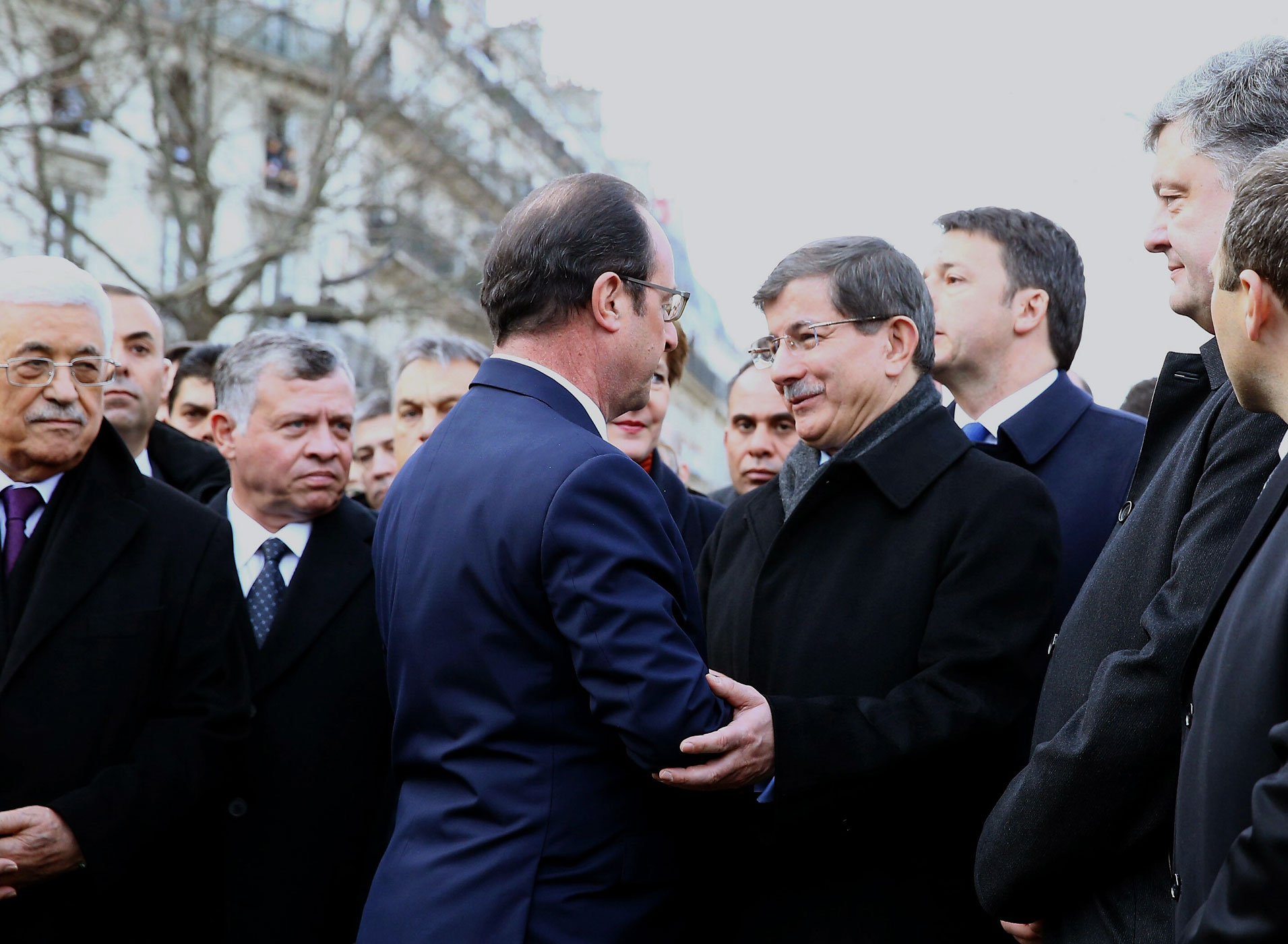 Turkish Prime Minister Ahmet Davutoglu, center right, talks to French President Francois Hollande, center left, during the Unity March 'Marche Republicaine' in Paris, France on Jan. 11, 2014. (Hakan Goktepe—Anadolu Agency/Getty Images)
