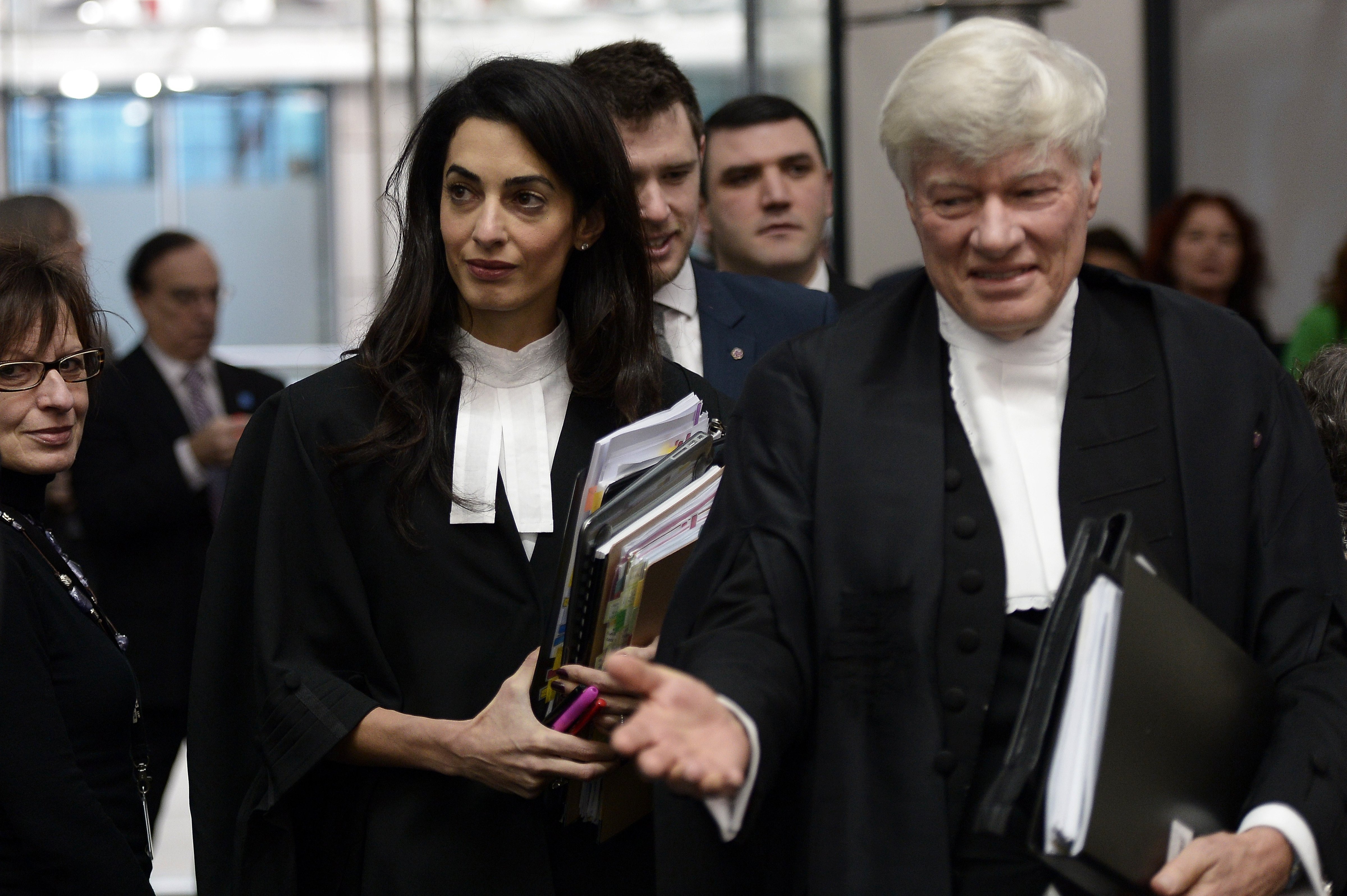 Lawyers Amal Clooney  and Geoffrey Robertso, arrive on Jan. 28, 2015 to attend the appeal hearing in Perincek case before the European Court of Human Rights in Strasbourg, France. (Frederick Florin—AFP/Getty Images)
