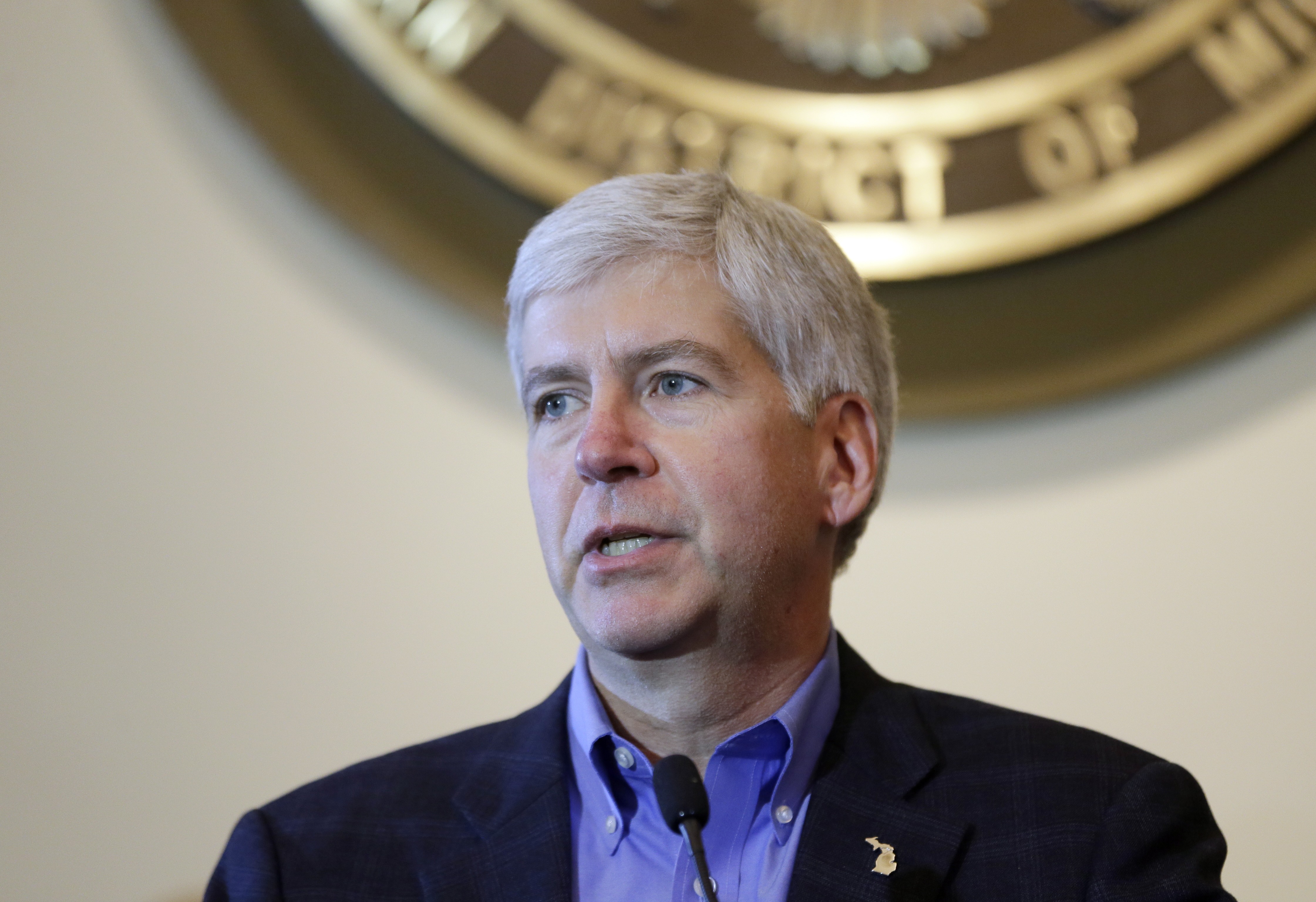 Michigan Gov. Rick Snyder addresses the media during a news conference in Detroit on Nov. 7, 2014. (Carlos Osorio—AP)
