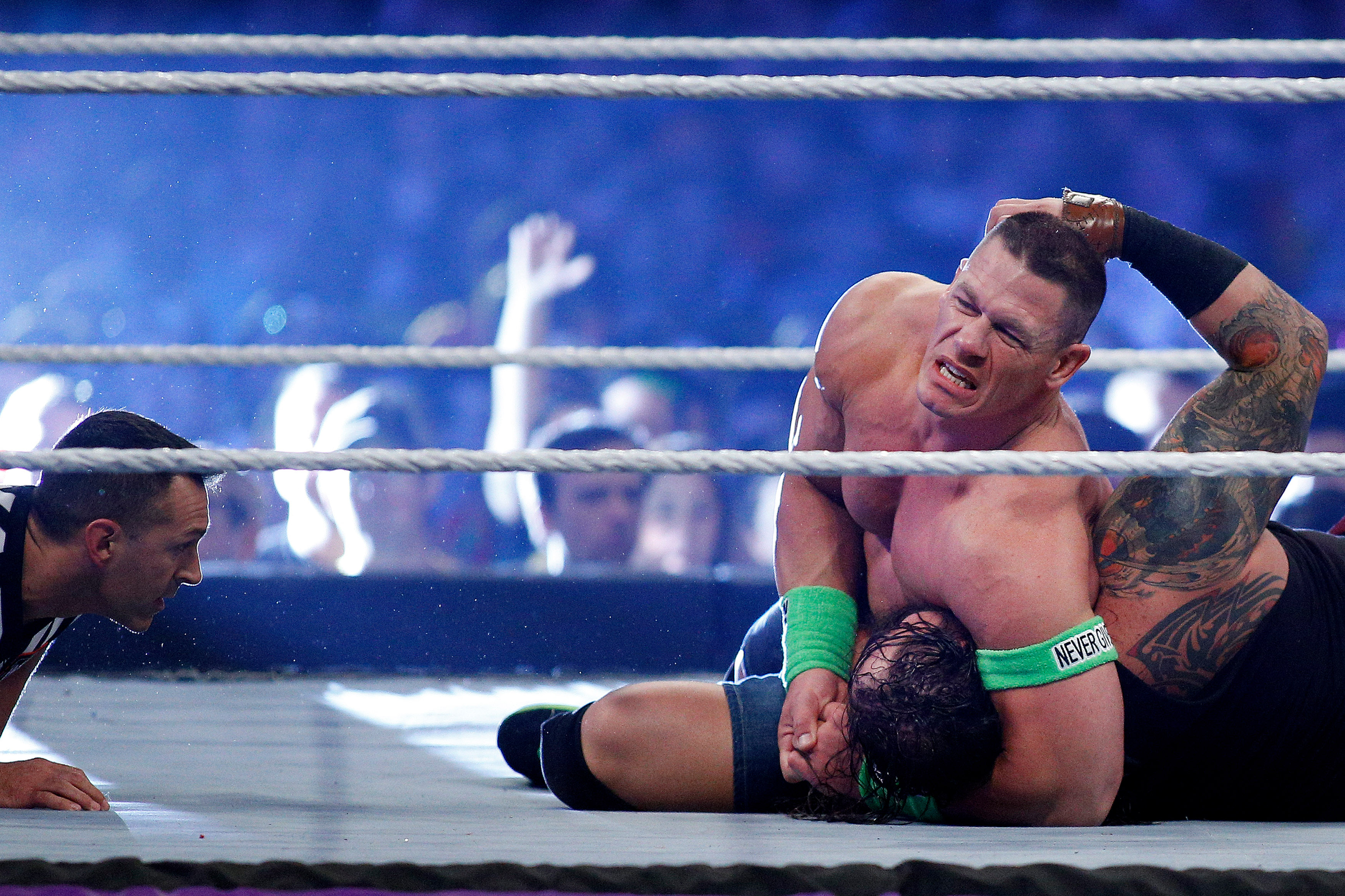John Cena, top, and Bray Wyatt compete during Wrestlemania XXX at the Mercedes-Benz Super Dome in New Orleans on April 6, 2014 (Jonathan Bachman — AP)