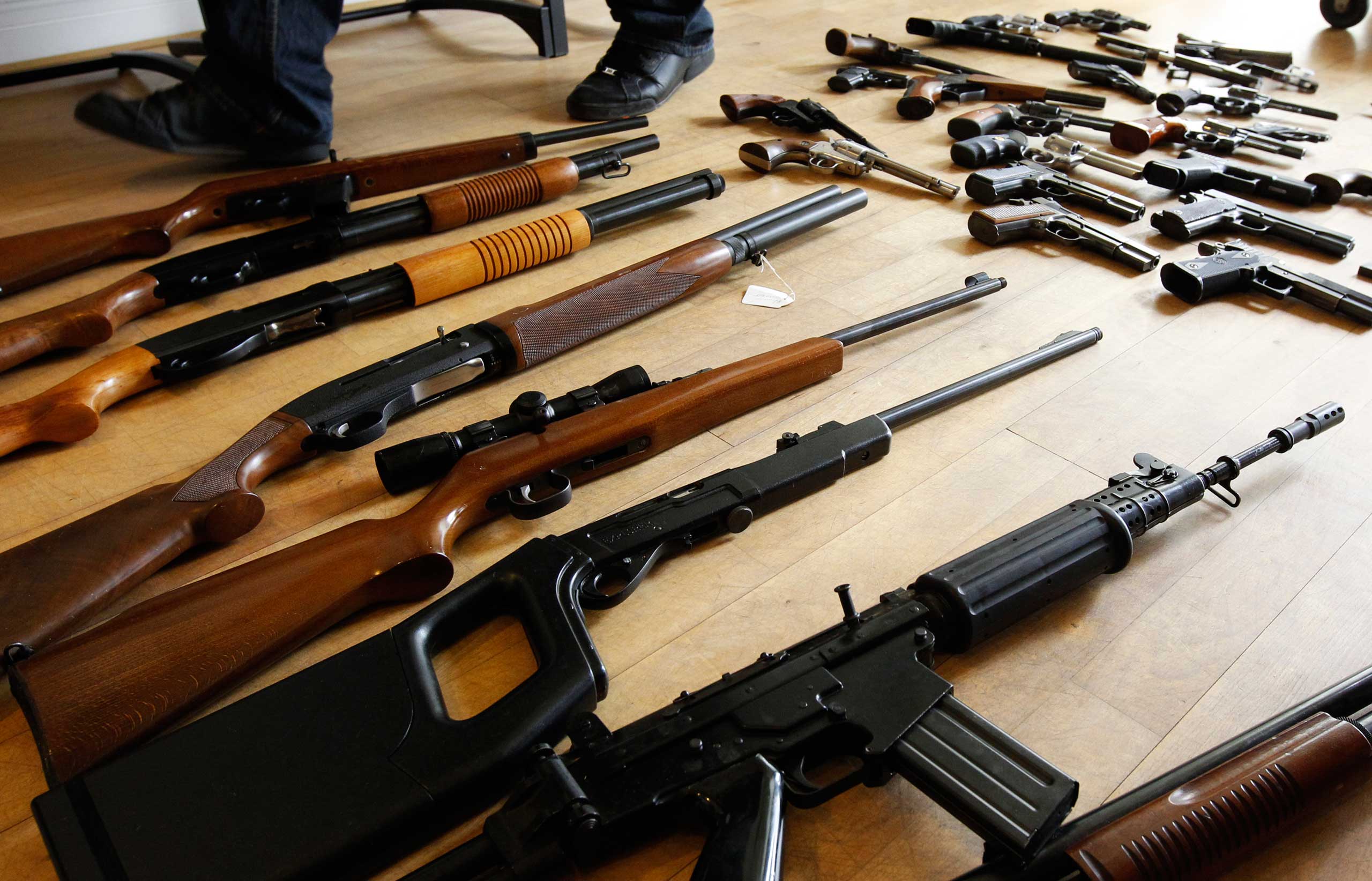 Firearms seized from a gang of weapon smugglers are displayed at the Federal Police headquarters in Brussels