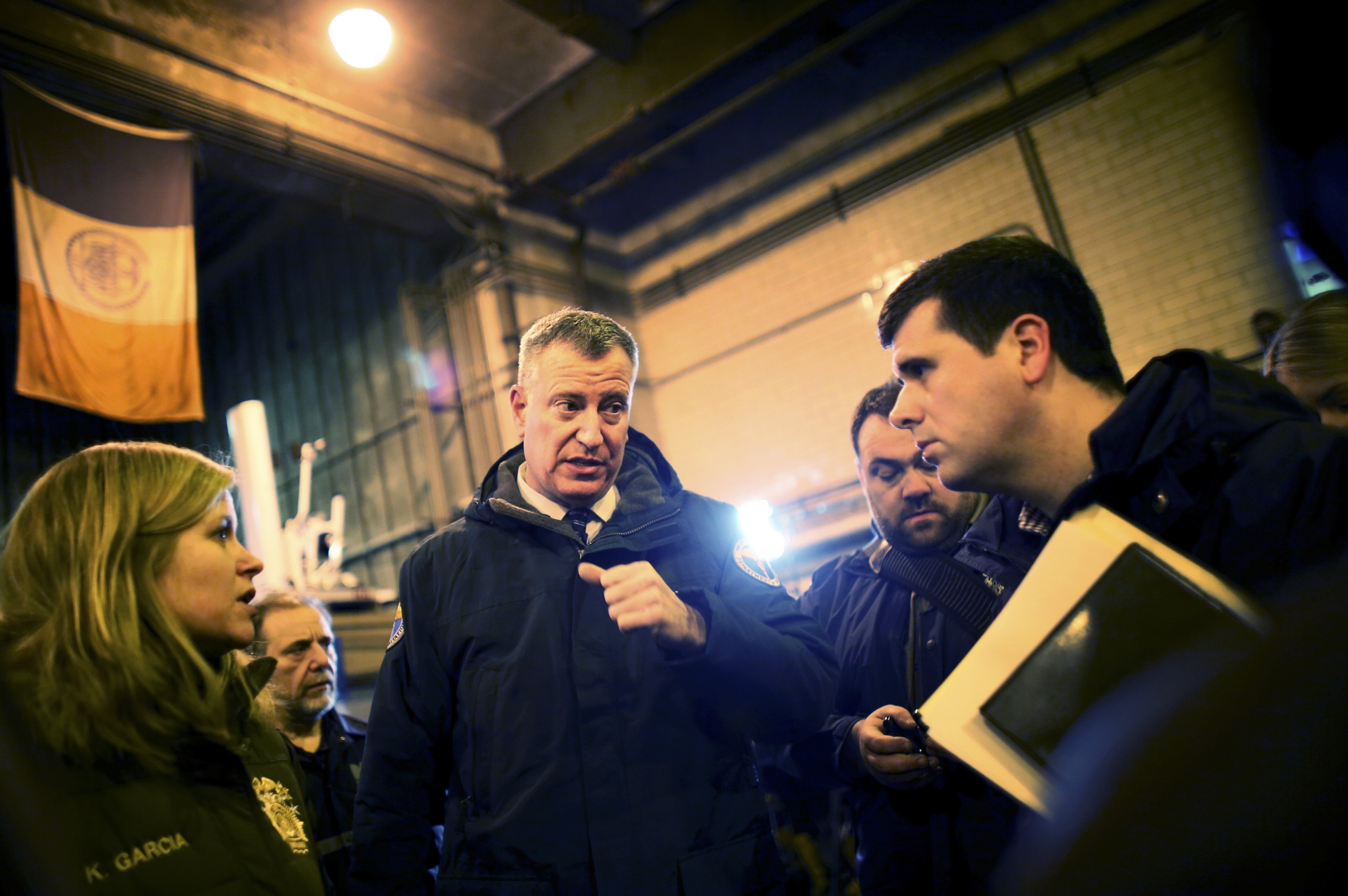New York City Mayor Bill de Blasio exits a news conference with Department of Sanitation workers in New York.