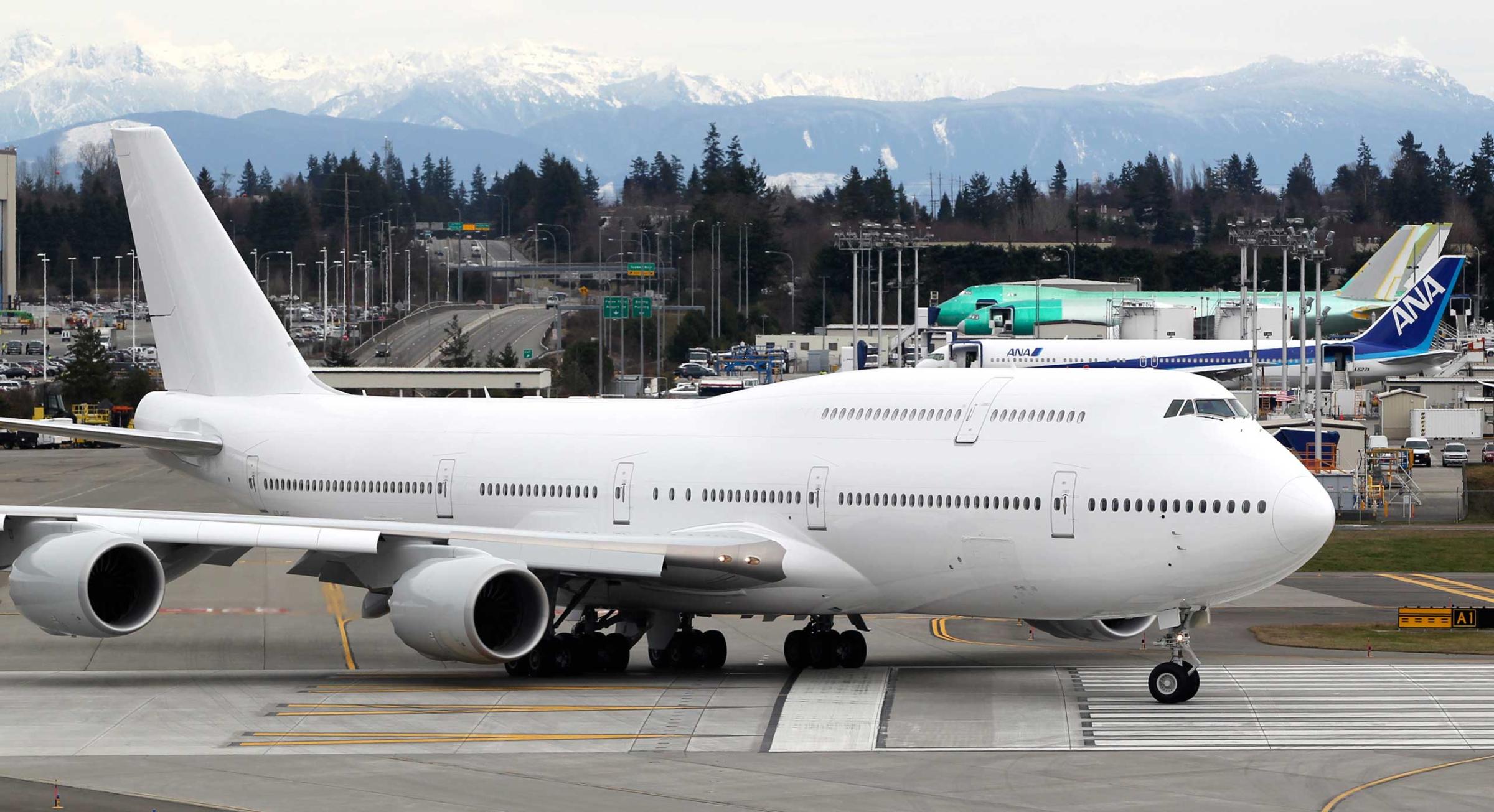 This Boeing 747-8 Intercontinental jetliner, the first VIP-configured aircraft, rolls out for an undisclosed customer for takeoff from Paine Field in Everett, Washington