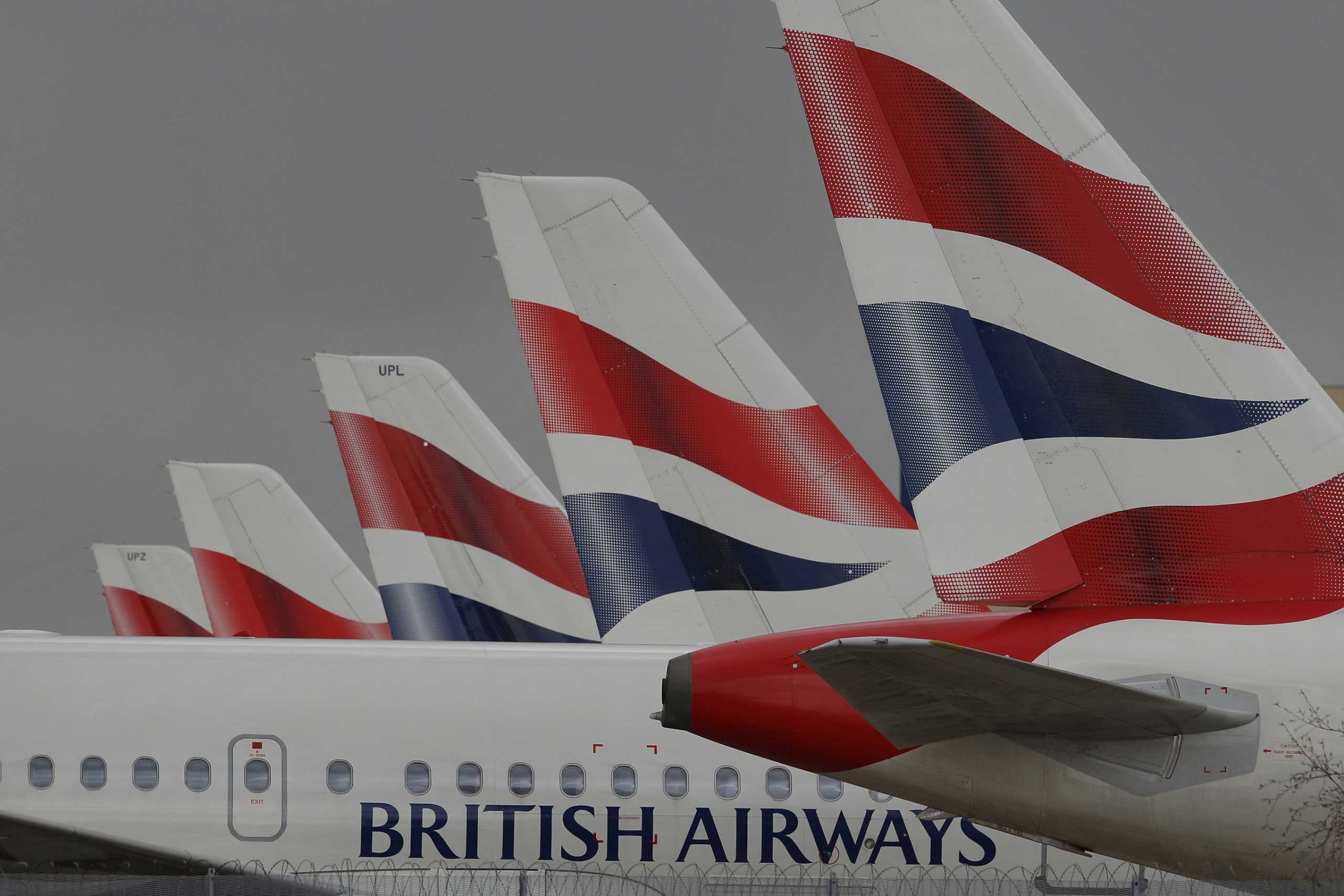 British Airways aircraft are parked on an apron at Heathrow airport during the first day of a strike by cabin crew on March 27, 2010 in London.