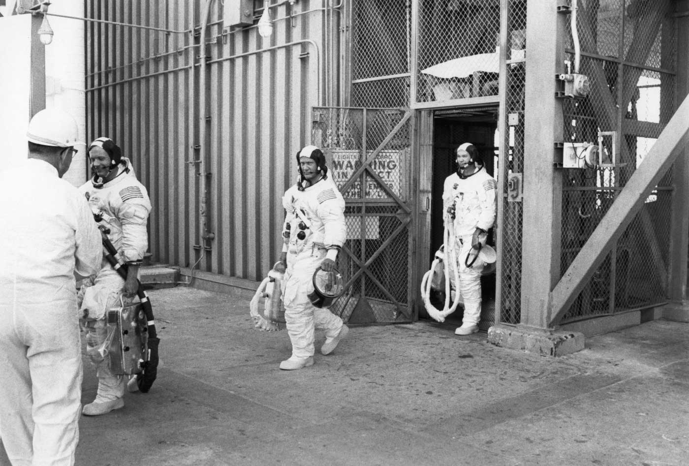 the apollo 11 crew walks to the van to take them to the launch pad (CK)