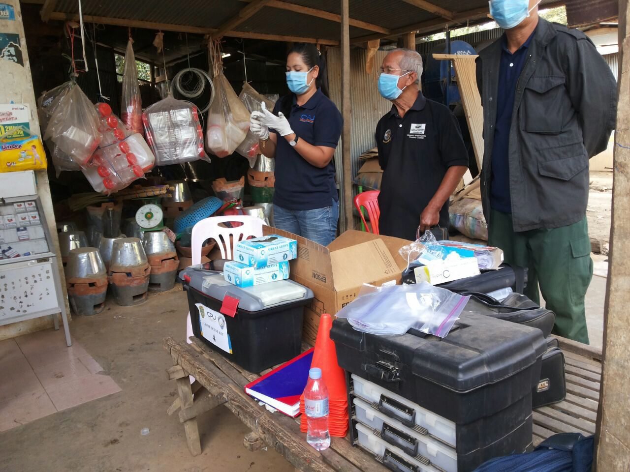 Cambodian officials prepare to inspect the perimeter of a nurse house after a local unlicensed doctor was charged with spreading HIV, in Roka commune in Battambang province, Cambodia, on Dec. 17, 2014. (EPA)