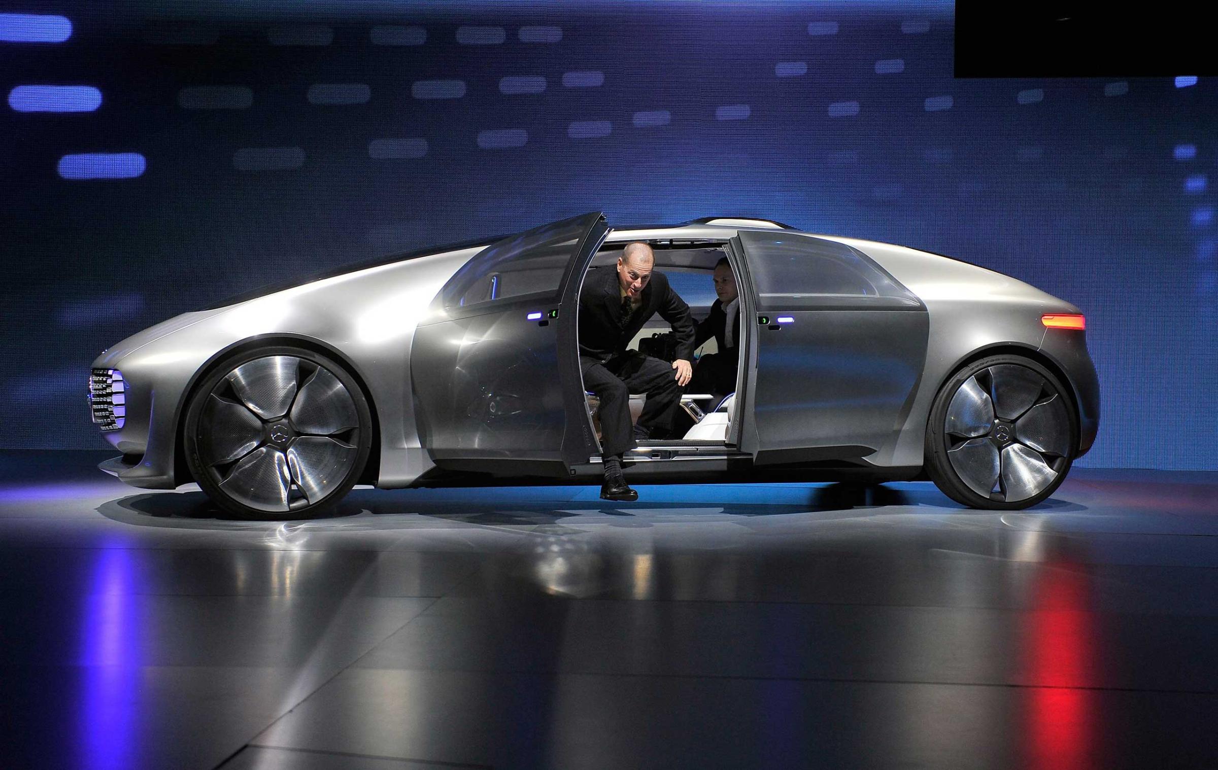 Consumer Electronics Association President and CEO Gary Shapiro exits a Mercedes-Benz F 015 autonomous driving automobile after it was unveiled at a Mercedes-Benz press event on Jan. 5, 2015.