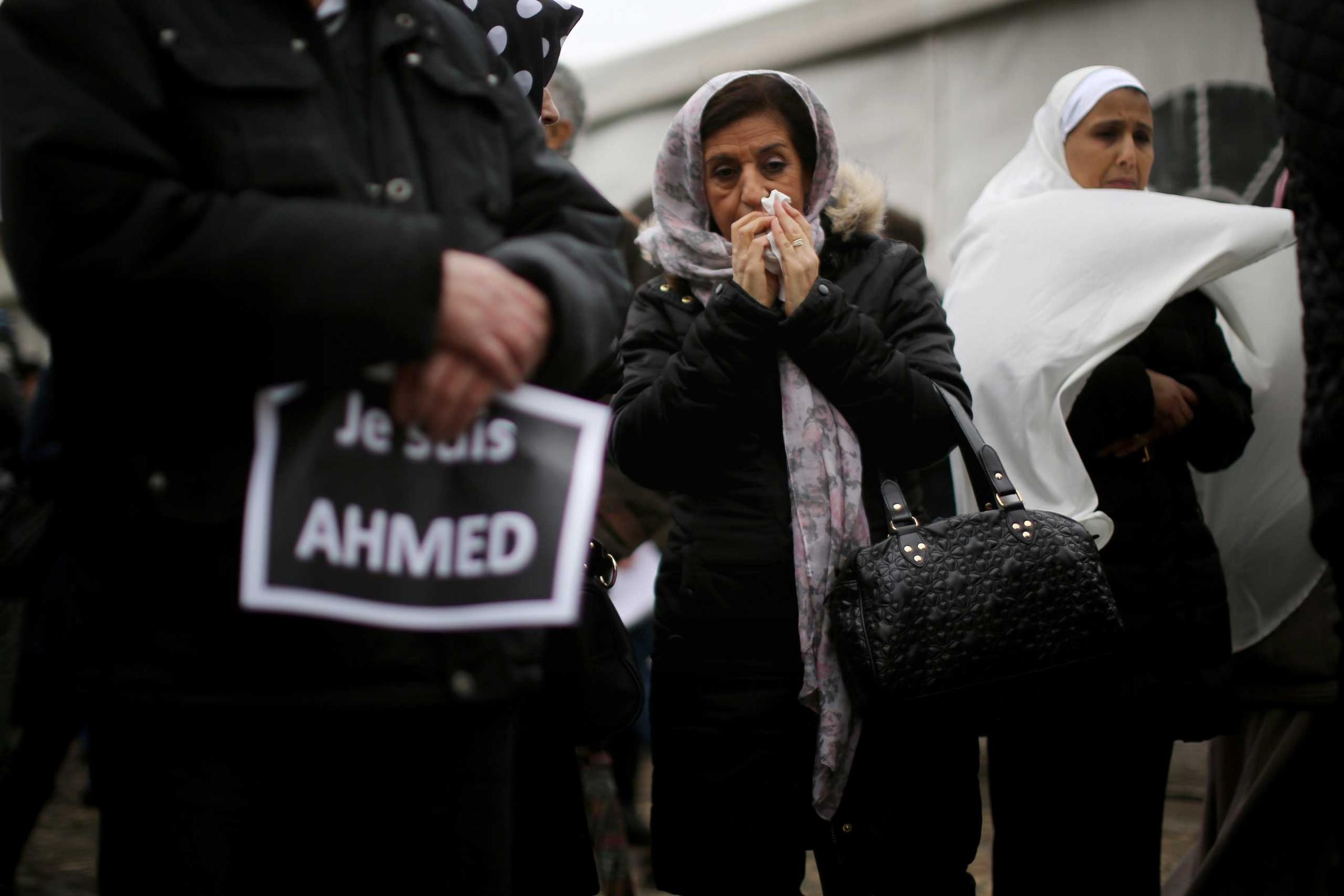 A female mourner reacts during the funeral of murdered police officer Ahmed Merabet at Bobigny Muslim cemetery on Jan. 13, 2015 in Bobigny, France.