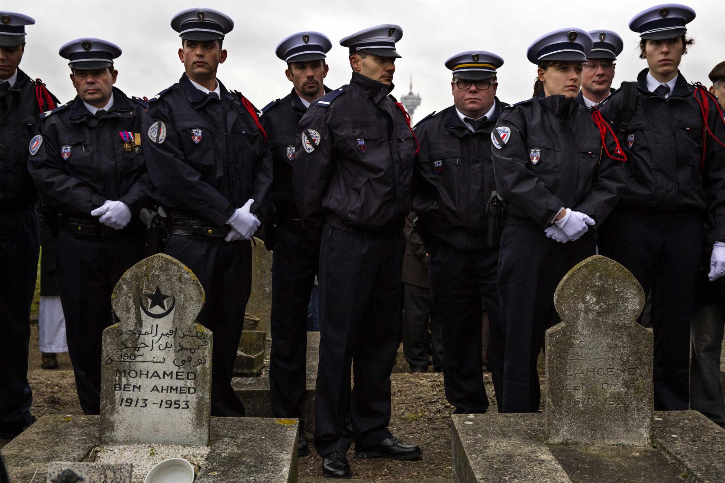 Police Officers line up at the funeral of murdered police officer Ahmed Merabet during the burial at a muslim cemetery on Jan. 13, 2015 in Bobigny, France.