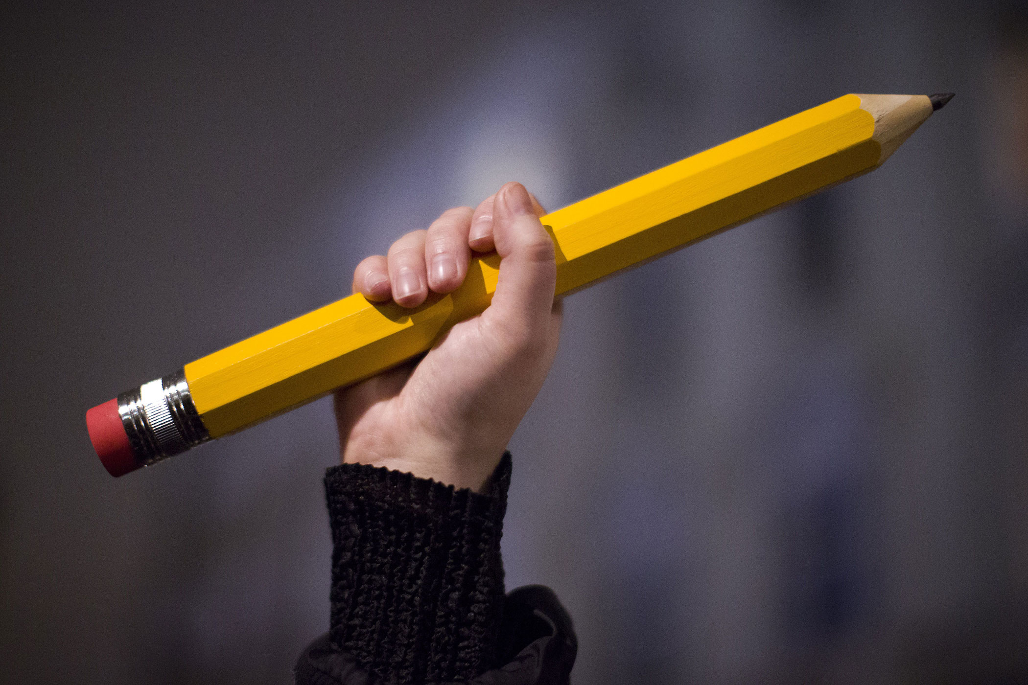 A giant pencil is held up at a vigil outside The French Institute in London on Jan. 9, 2015 for the 12 victims of the attack on the Paris offices of satirical weekly Charlie Hebdo. (Justin Tallis—AFP/Getty Images)