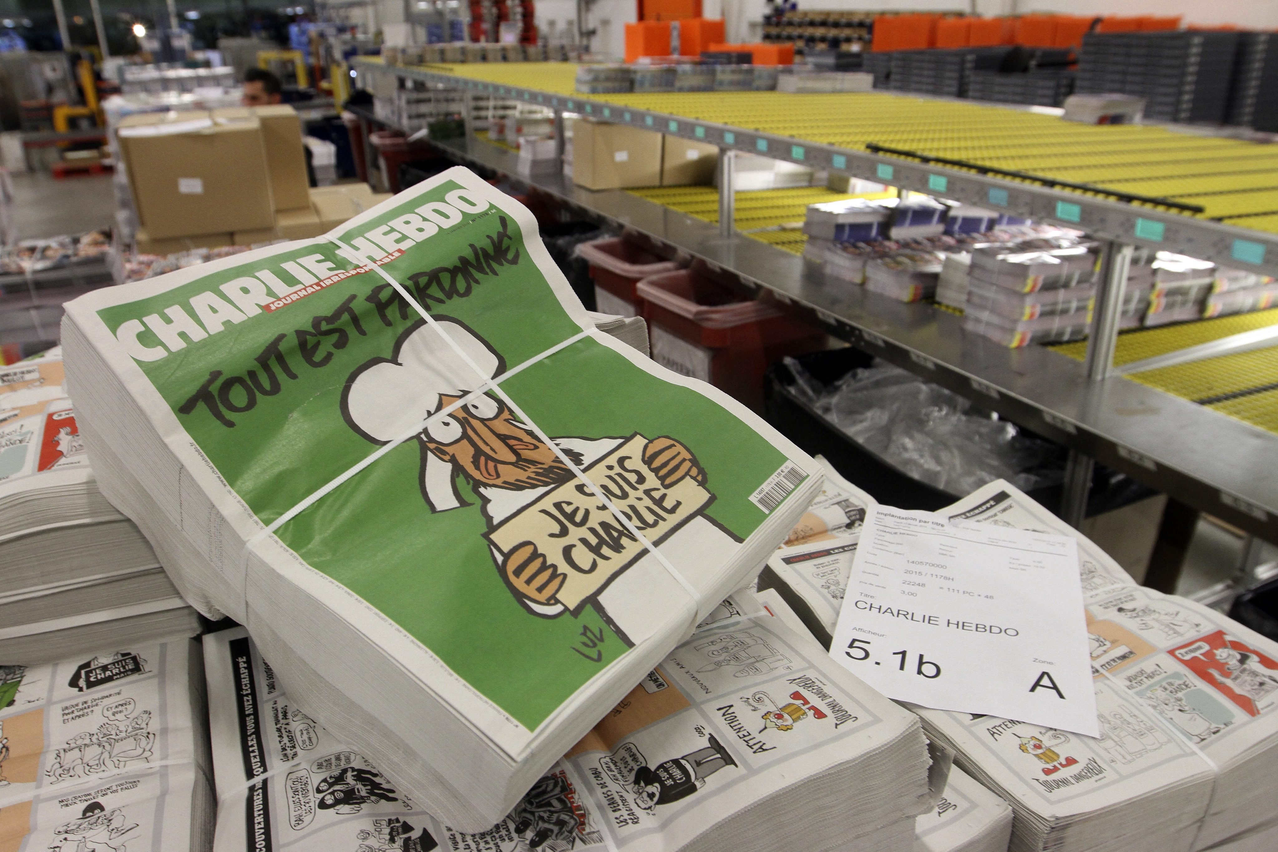 Copies of the upcoming edition of the French satirical magazine 'Charlie Hebdo' are stacked at a distribution centre in Nantes, France, on Jan 13, 2014. (Eddy Lemaistre—EPA)