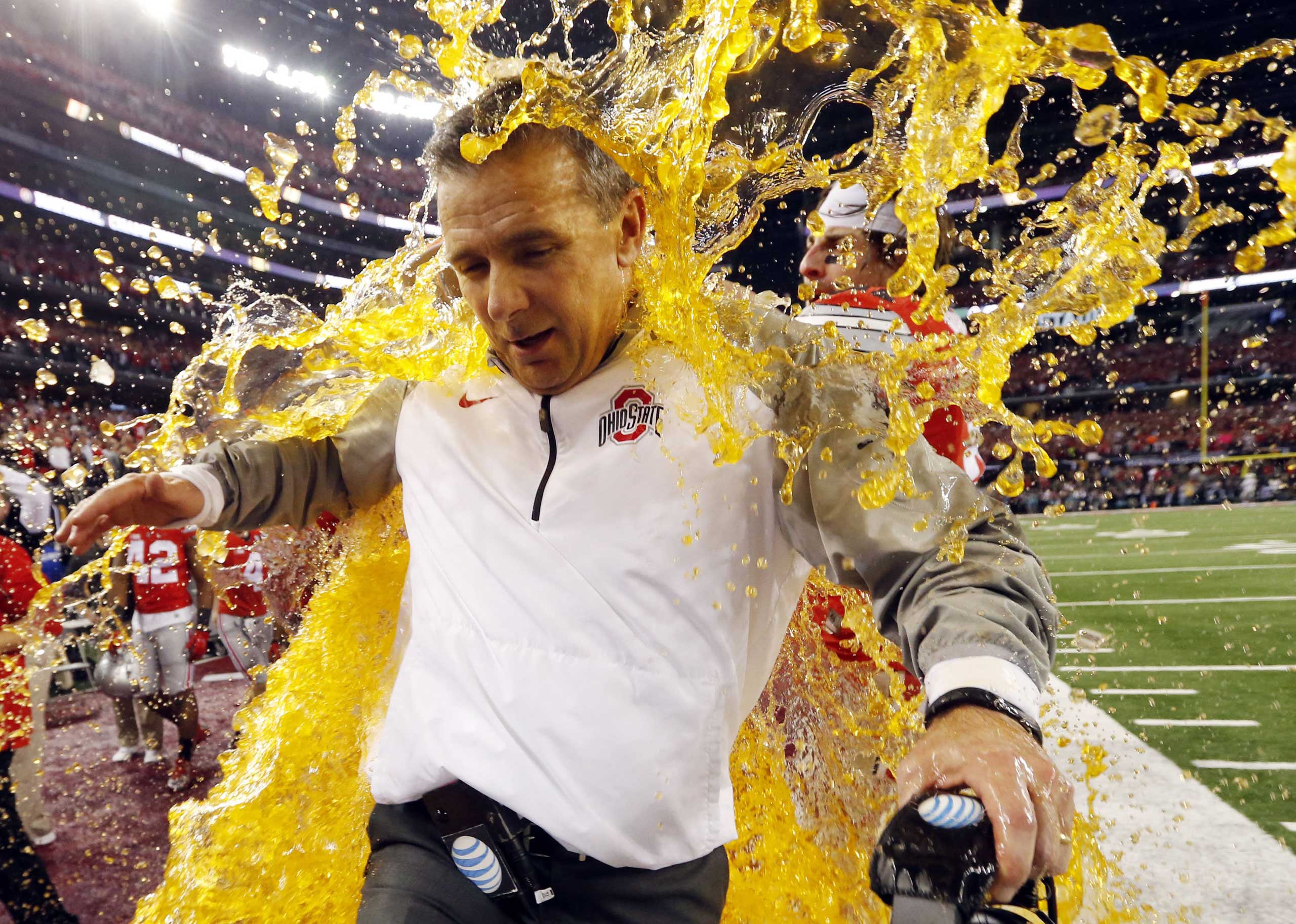 Ohio State head coach Urban Meyer is dunked with Gatorade during the NCAA college football playoff championship game against Oregon on Jan. 12, 2015, in Arlington, Texas.
