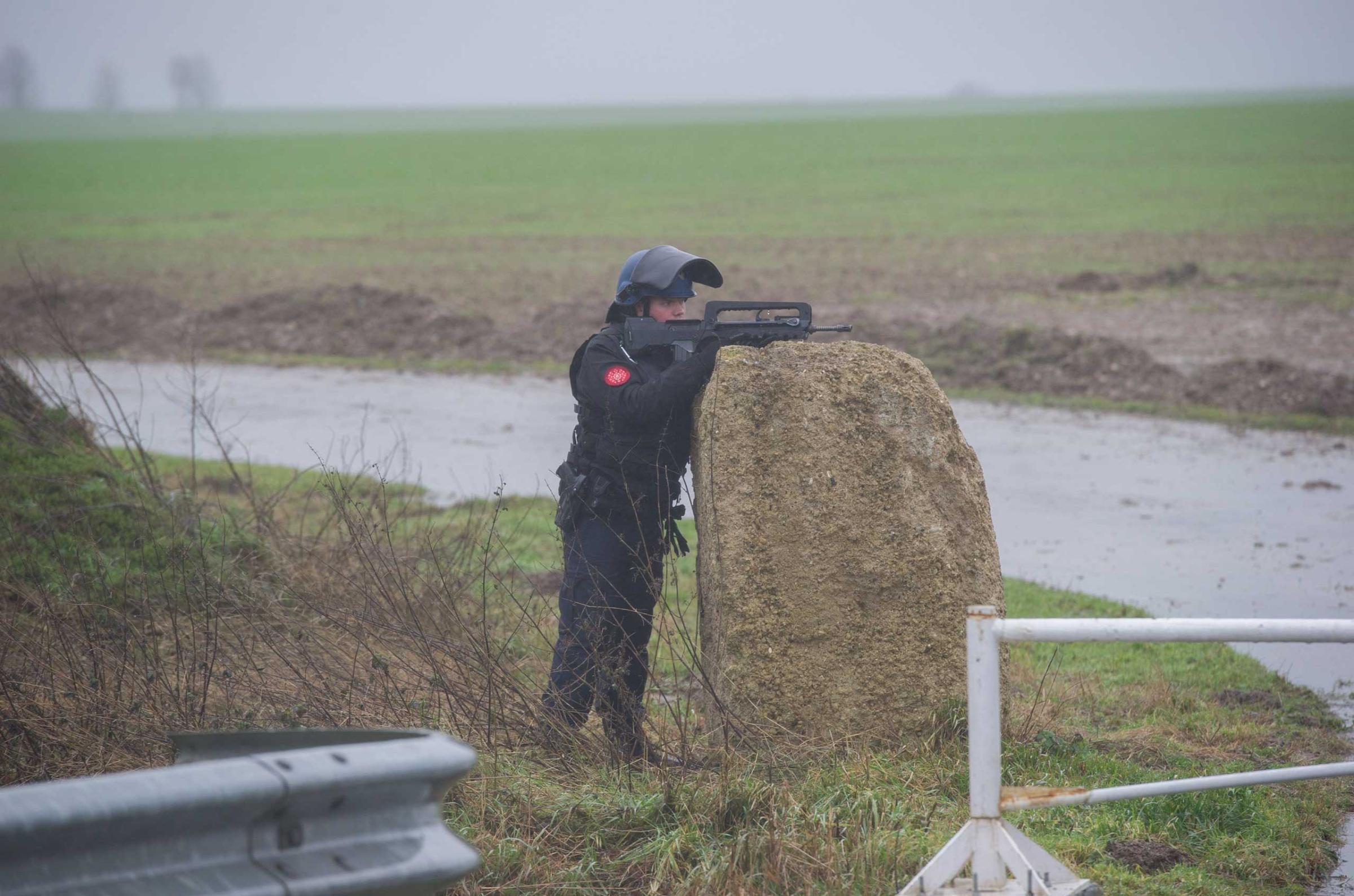 French police officers patrol in Dammartin-en-Goele where two brothers suspected of slaughtering 12 people in an Islamist attack on French satirical newspaper Charlie Hebdo held one person hostage as police cornered the gunmen, on Jan. 9, 2015.