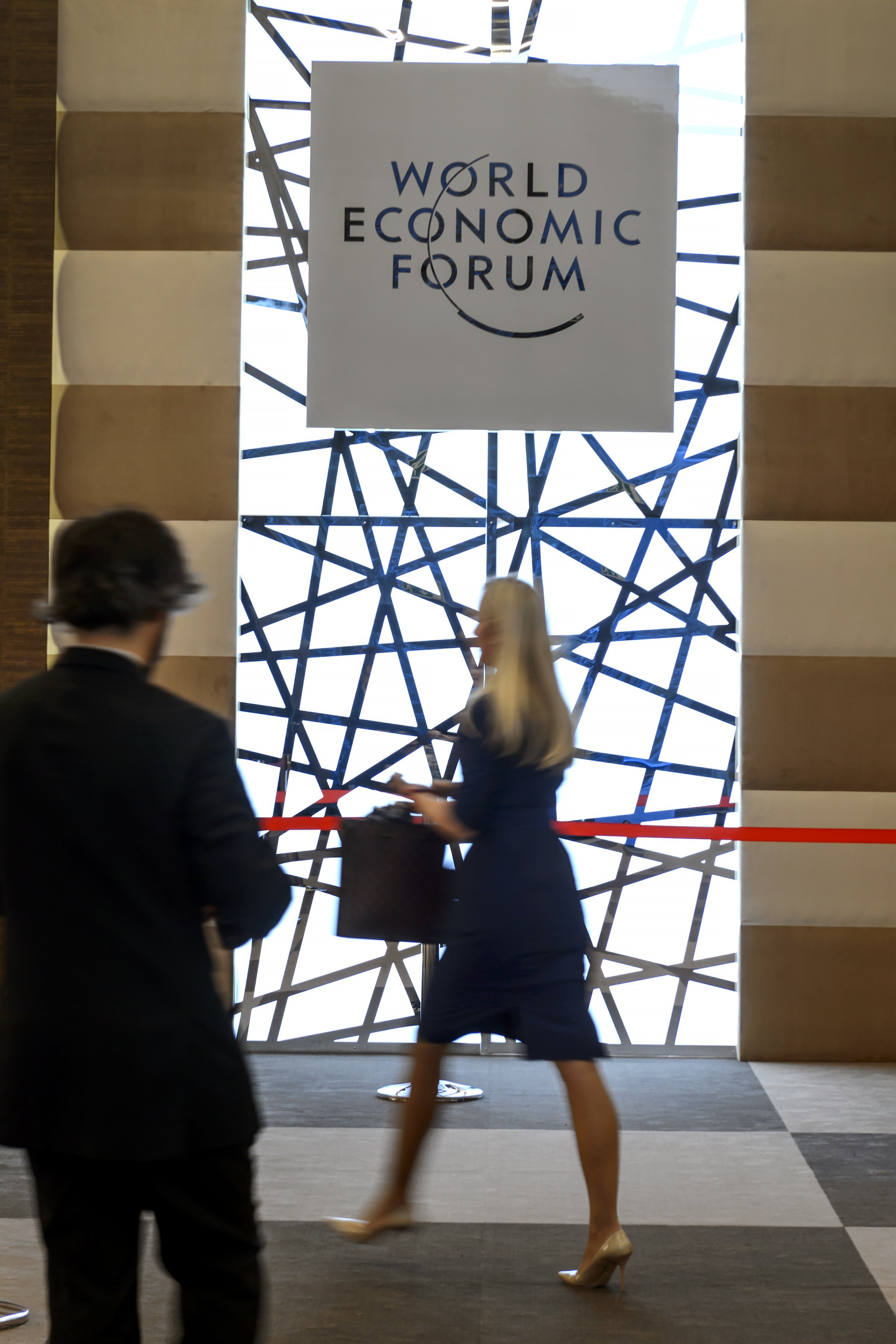 People enter the World Economic Forum (WEF) in Davos, Switzerland on Jan. 20, 2015.
