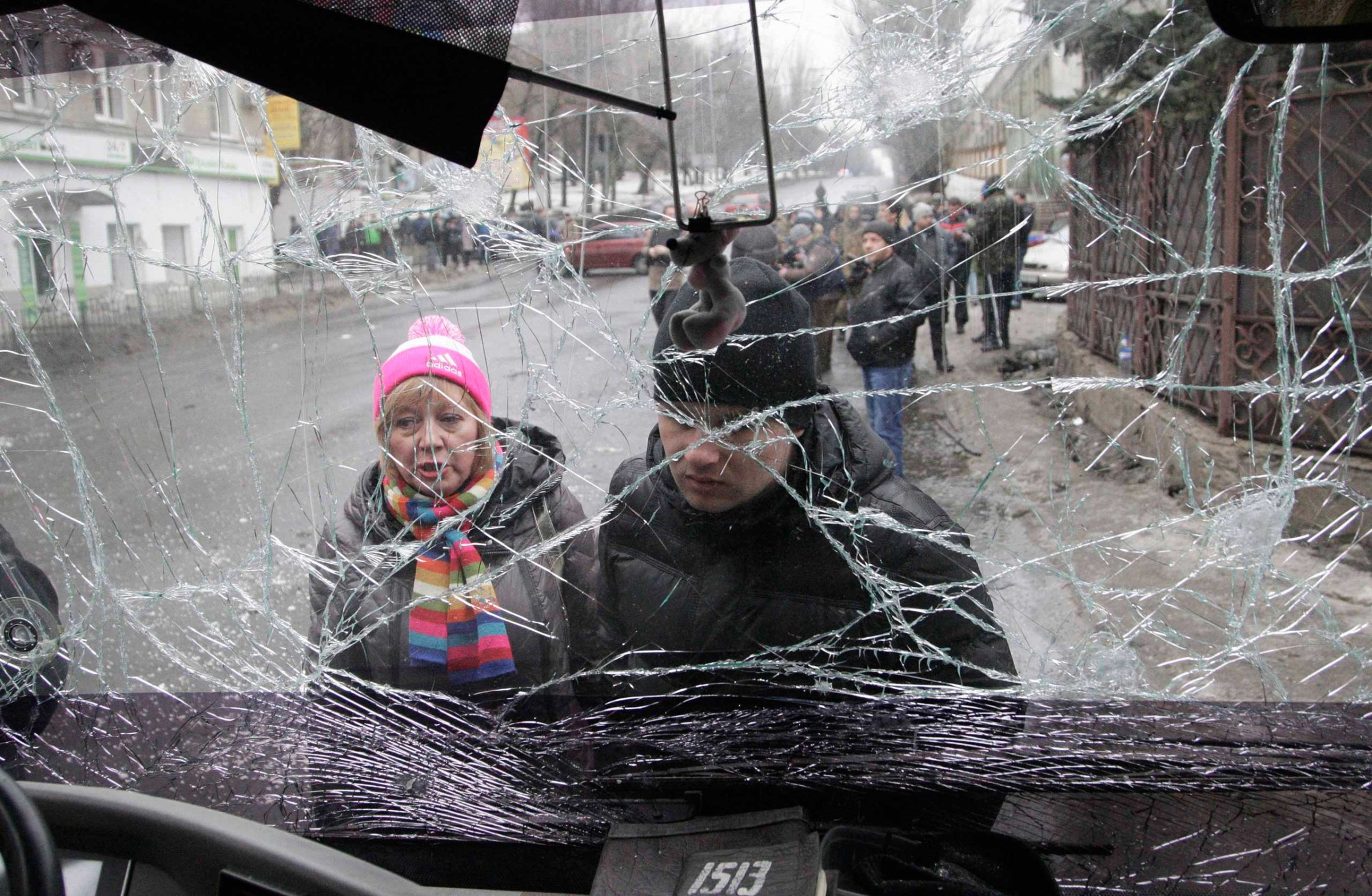 People look through the front windshield of a damaged trolleybus in Donetsk, Jan. 22, 2015.
