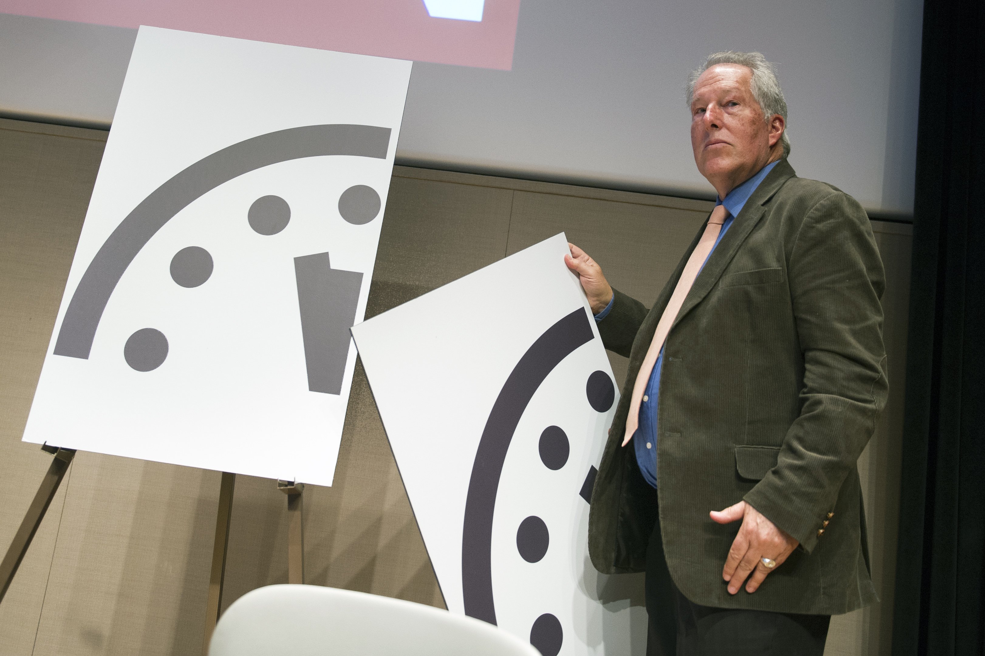Climate scientist Richard Somerville, a member, Science and Security Board, Bulletin of the Atomic Scientists, unveils the new Doomsday Clock in Washington on Jan. 22, 2015.