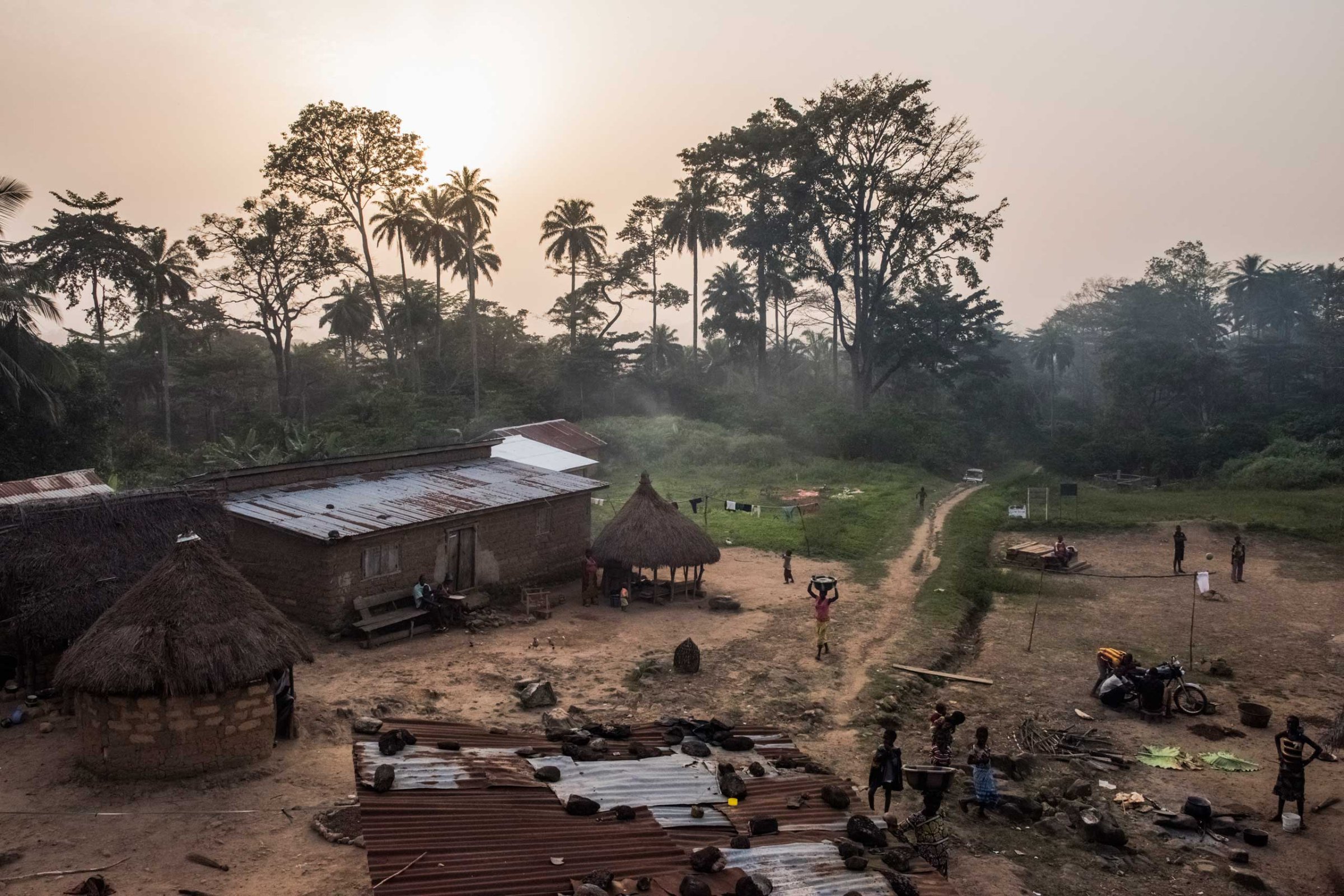 Residents set in for the evening in the village of Meliandou, Guinea, where a 1-year-old boy named Emile Ouamouno came down with symptoms consistent with Ebola and died in late December 2013.