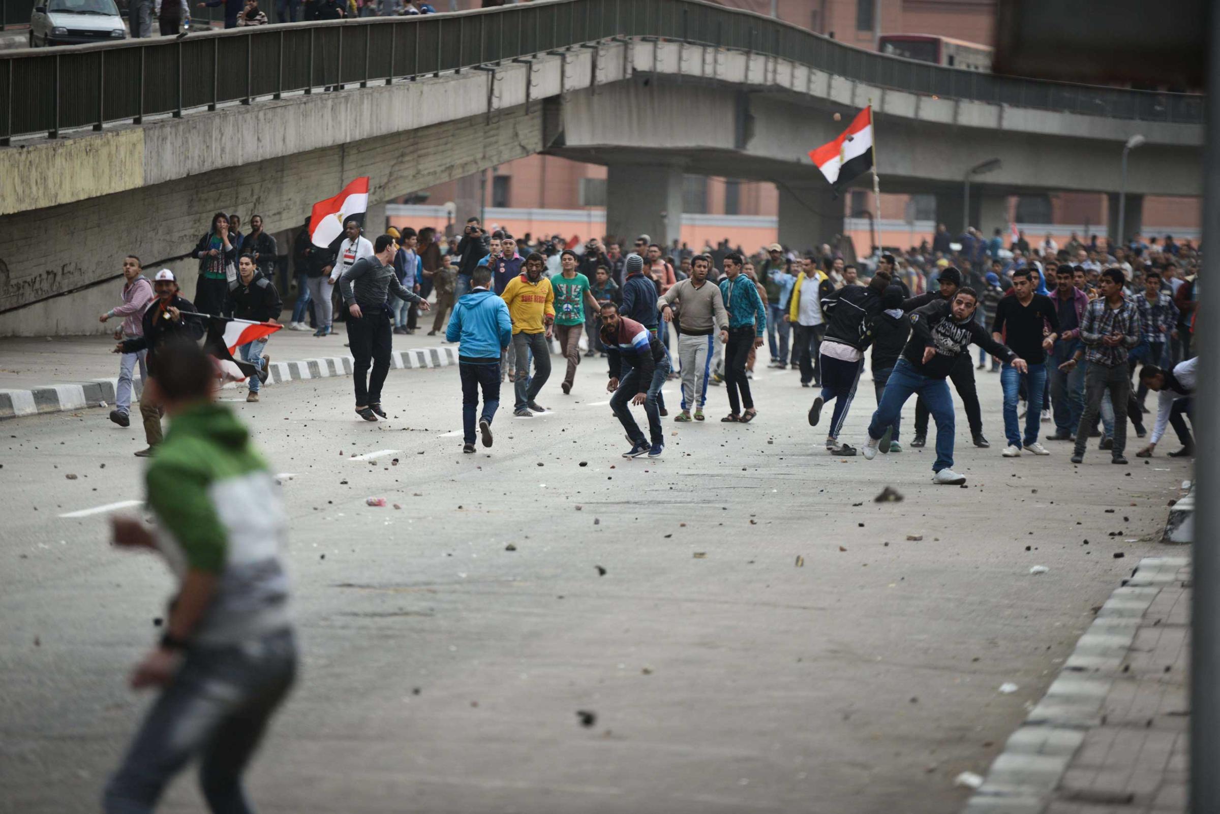Supporters of President Abdul Fattah al-Sisi clash with anti-government protesters following demonstrations in Cairo on Jan. 25, 2015.