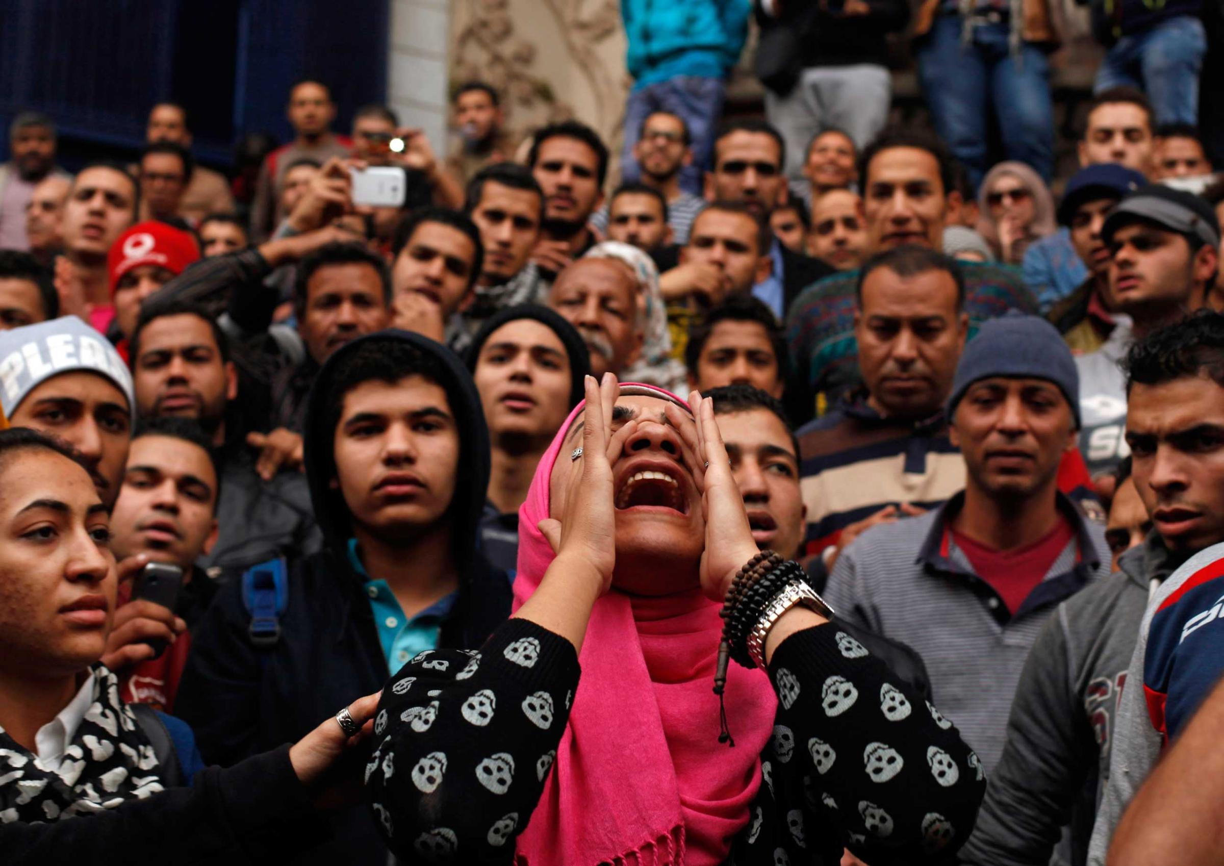 An anti-government protester chants slogans during a protest in front of the journalists' syndicate in Cairo, Jan. 25, 2015.
