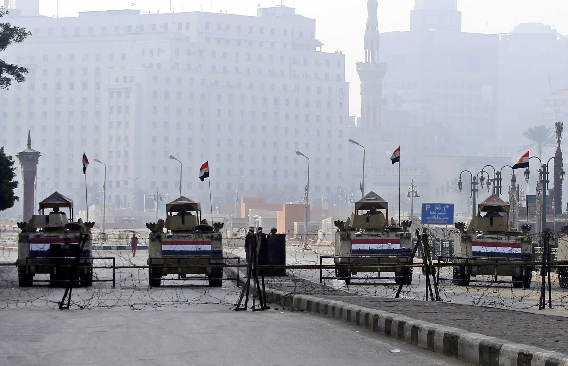 Egyptian army APCs block an entrance to Tahrir Square, Cairo, Jan. 25, 2015.