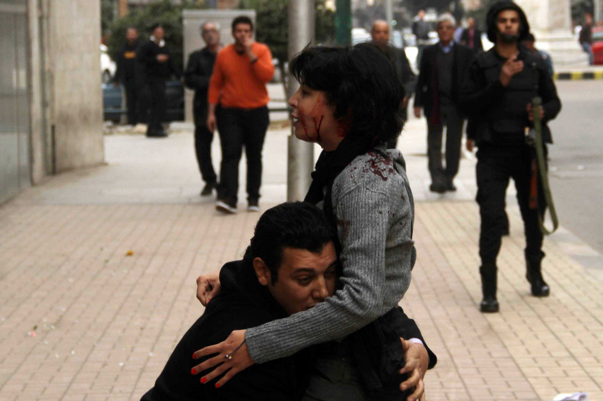 Socialist Popular Alliance Party activist Shaimaa al-Sabbagh receives help after she was shot during a protest by the party in Cairo, Jan. 24, 2015.