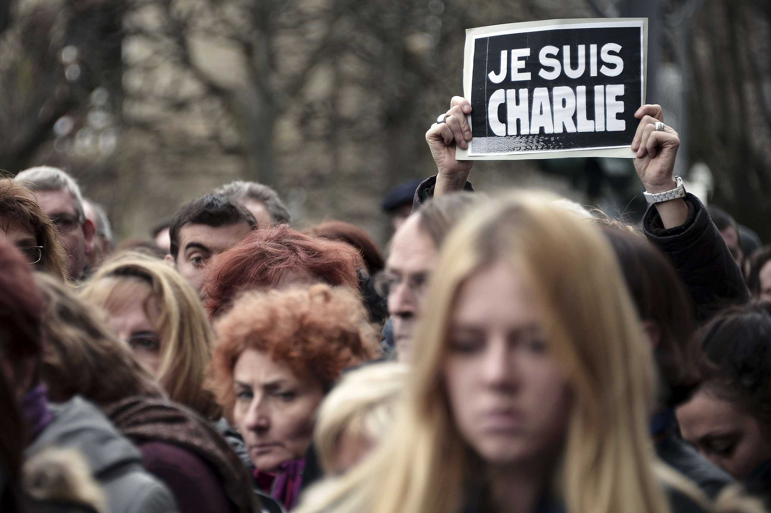 People observe a minute of silence in Strasbourg, eastern France on Jan. 8, 2015.