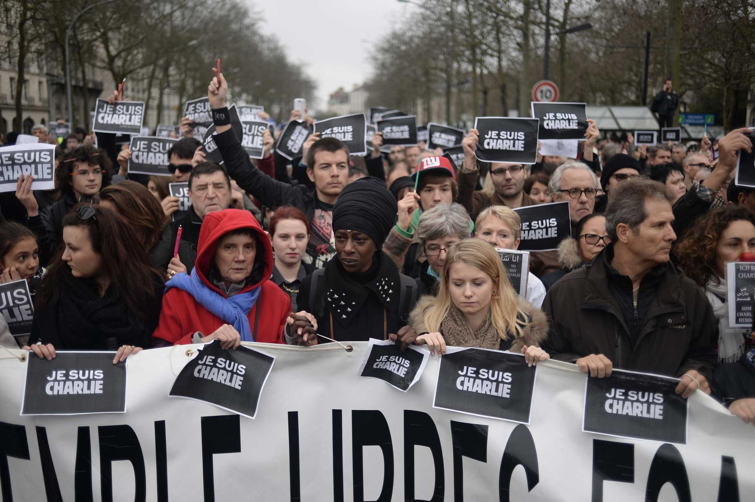 Demonstrators hold signs that reads "Je suis Charlie" during a rally in Nantes on Jan. 10, 2015,.