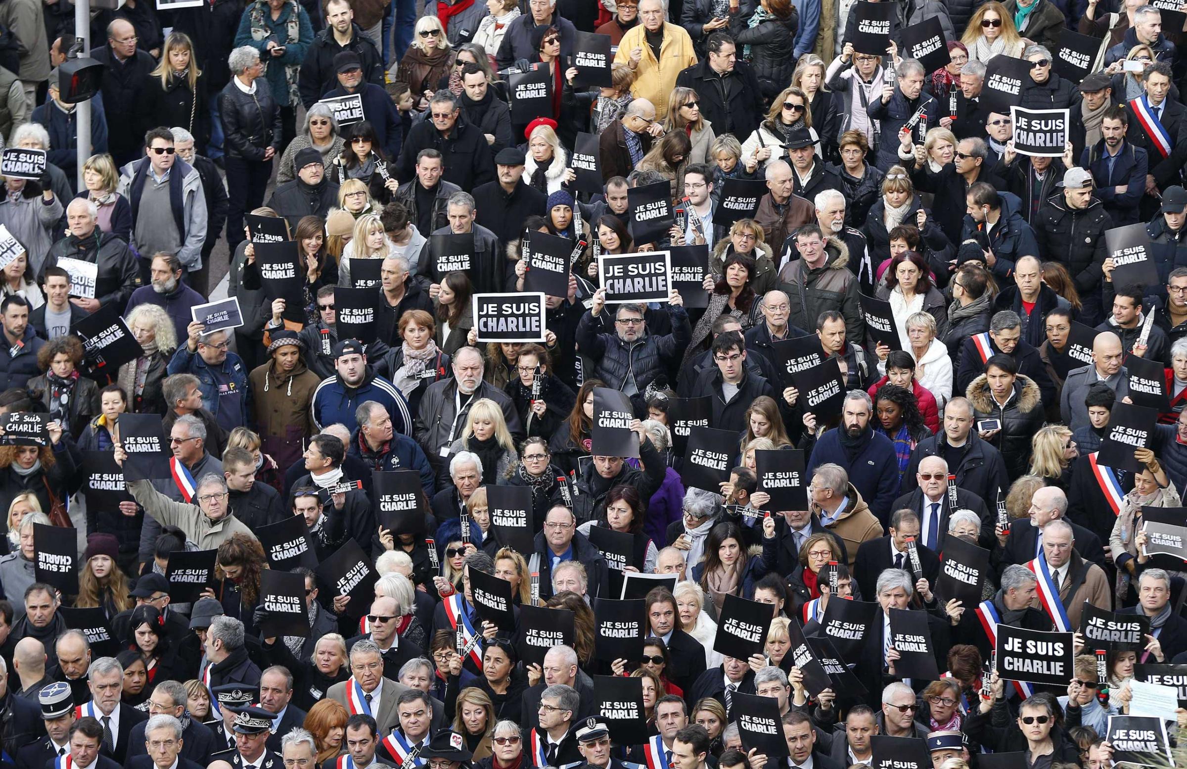 Tens of thousands of people some holding up signs that read, "Je suis Charlie" march during a rally along the sea front in the Mediterranean city of Nice, on January 10, 2015.