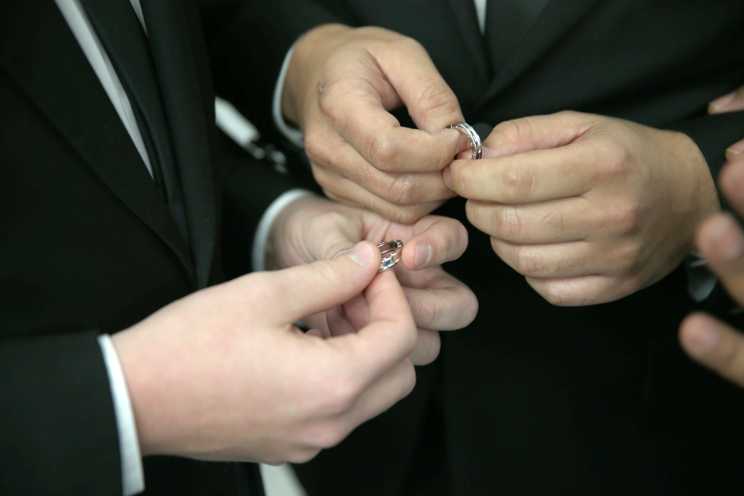 A couple exchange rings as they are wed during a wedding ceremony at the Broward County Courthouse on Jan. 6, 2015 in Fort Lauderdale, Fla