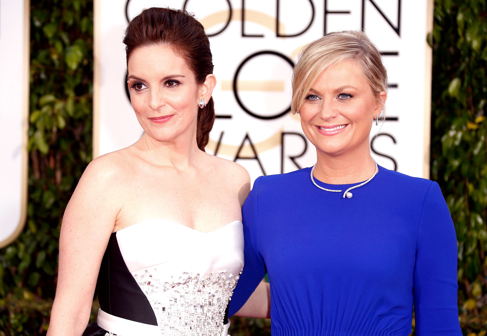 Hosts Tina Fey and Amy Poehler attend the 72nd Annual Golden Globe Awards at The Beverly Hilton Hotel on Jan. 11, 2015 in Beverly Hills, Calif. (Jeff Vespa—WireImage/Getty Images)