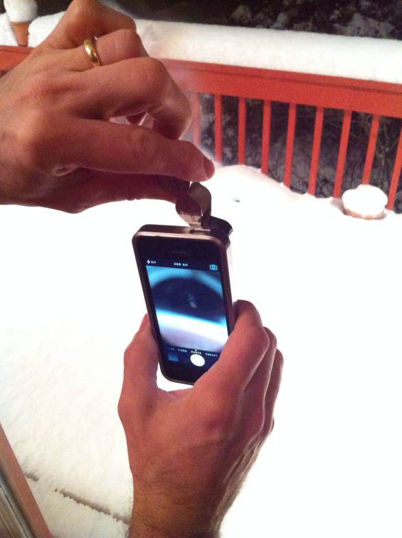 Miller photographed the snowflakes by holding a loupe up to the lens on his iPhone