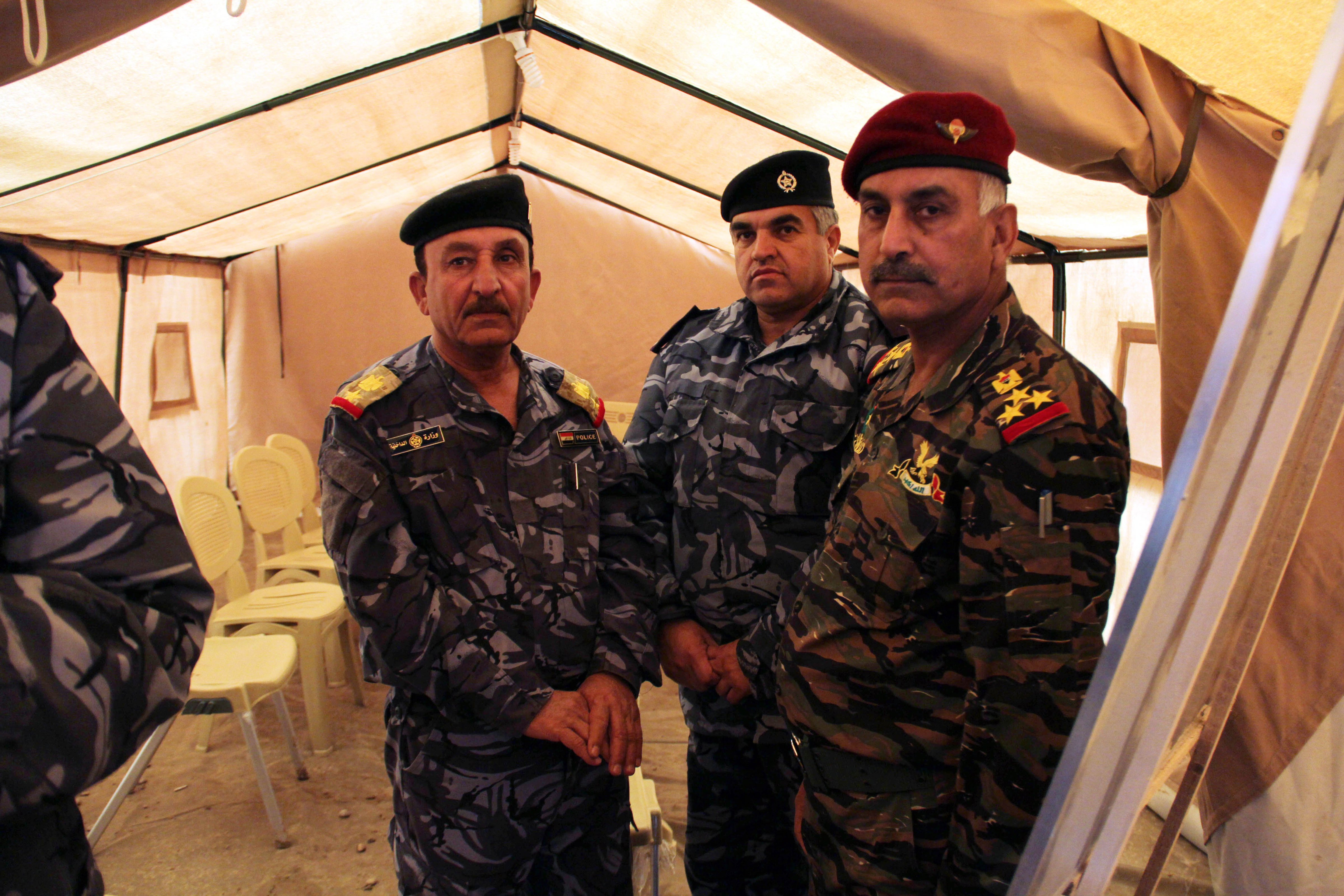 Moshir Al-Jabour (left) in a training camp for police from Mosul. (Rebecca Collard)