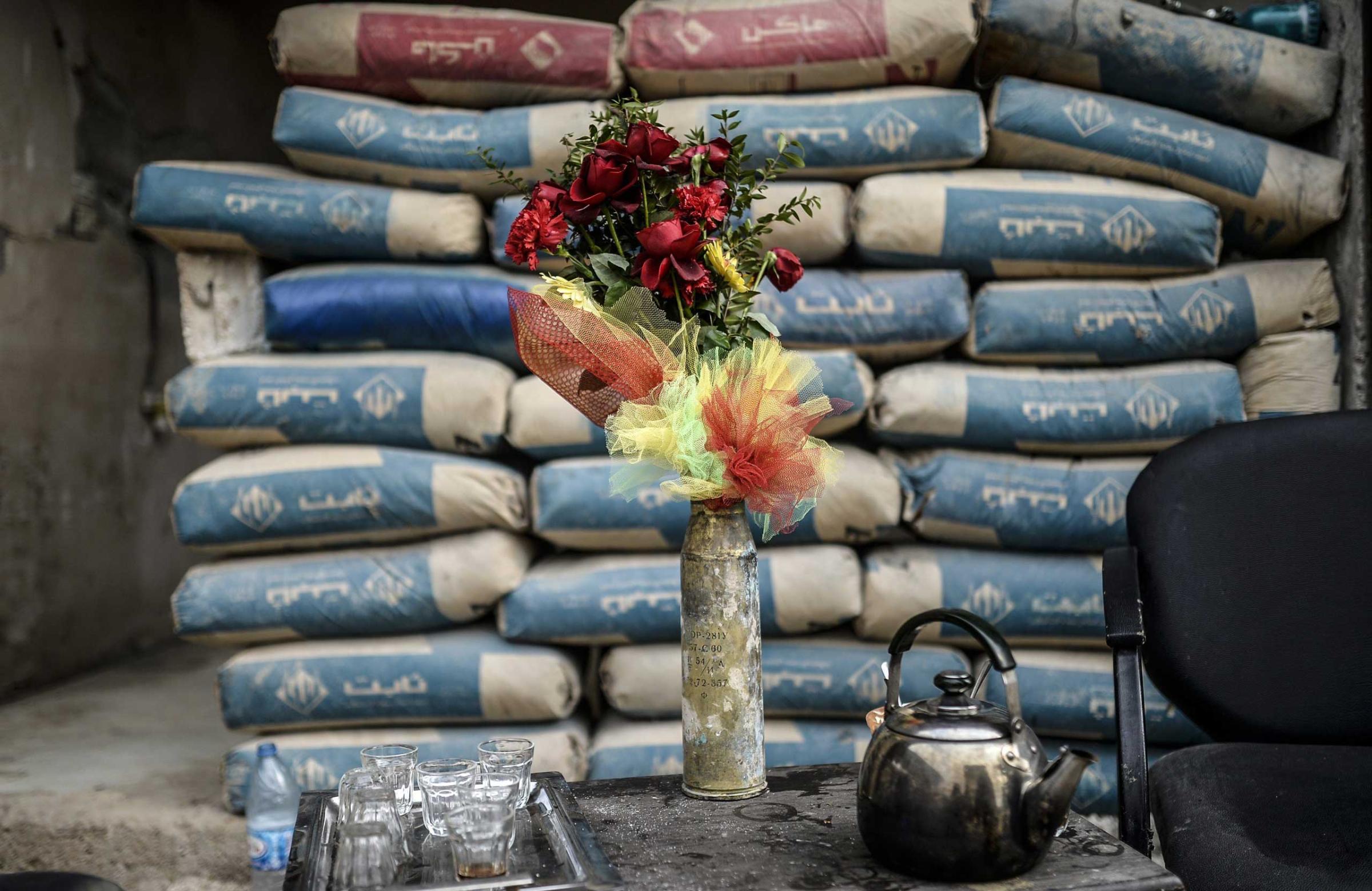 A shell is used as a vase in the Syrian border town of Kobani on Jan. 28, 2015.
