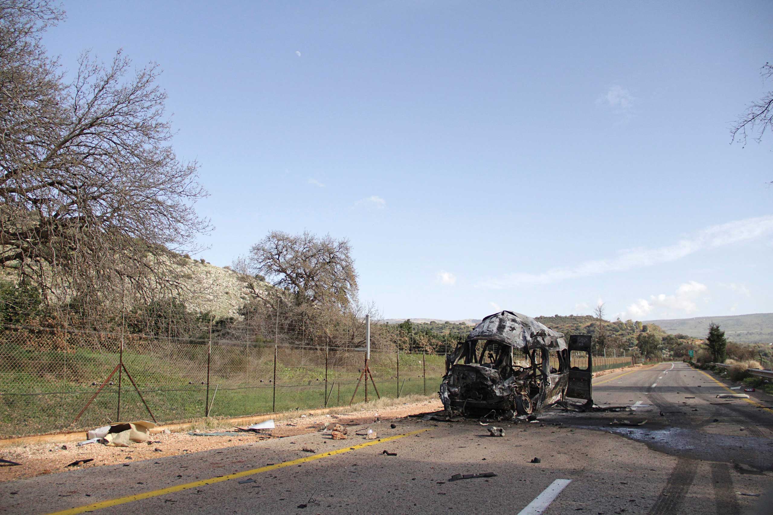 A burnt vehicle is seen near the village of Ghajar on Israel's border with Lebanon, Jan. 28, 2015.