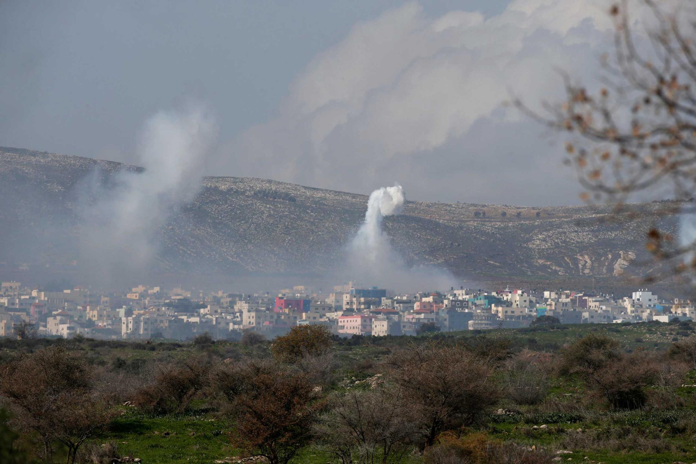 Smoke rises after an explosion in the Lebanese village of Ghajar on the Israeli-Lebanese border Jan. 28, 2015.