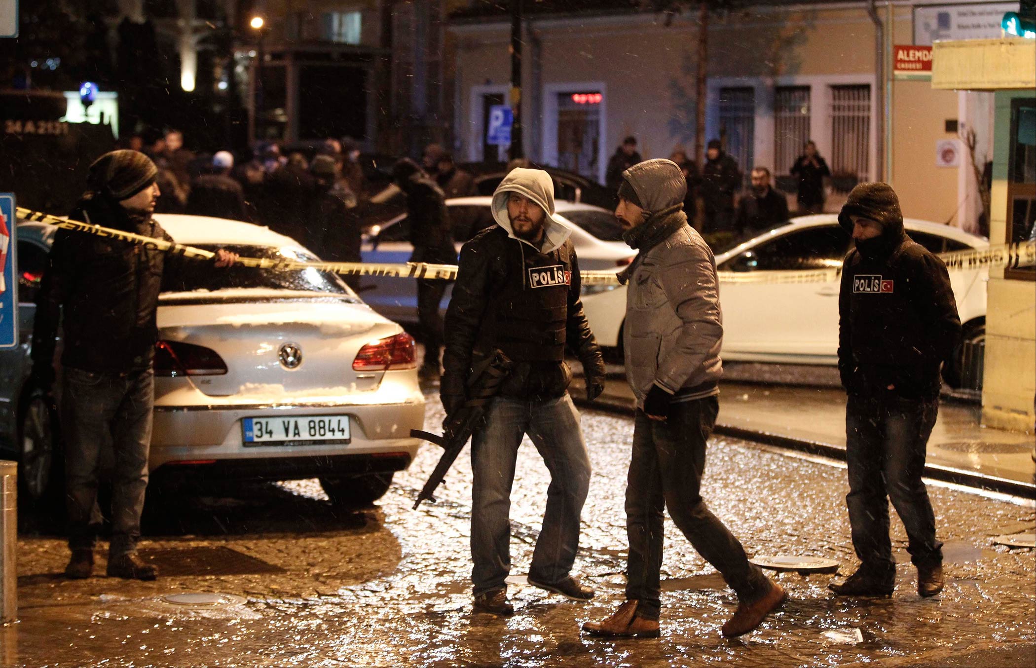 Police officers stand guard at the scene of a bomb blast in Istanbul, Turkey on Jan. 6, 2015. (Osman Orsal—Reuters)