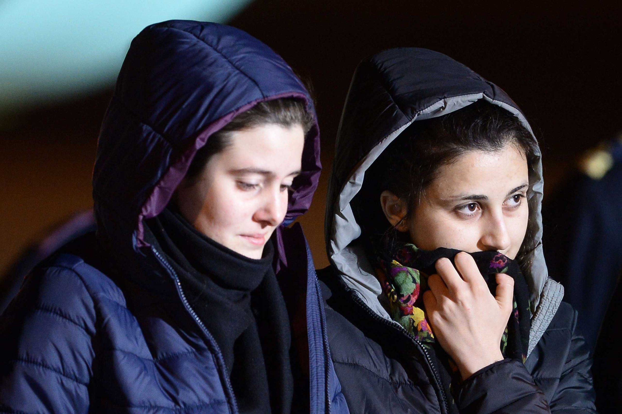 Italian aid workers abducted in Syria last summer, Greta Ramelli (L) and Vanessa Marzullo arrive at Ciampino airport in Rome early on Jan. 16, 2015.