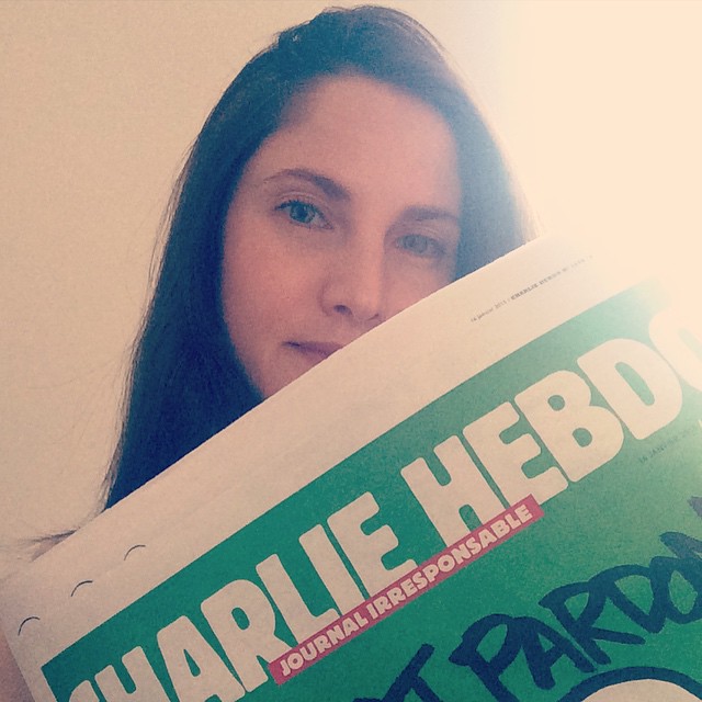 Journalist Clélie Mathias posted this photo of herself holding the new issue of Charlie Hebdo
