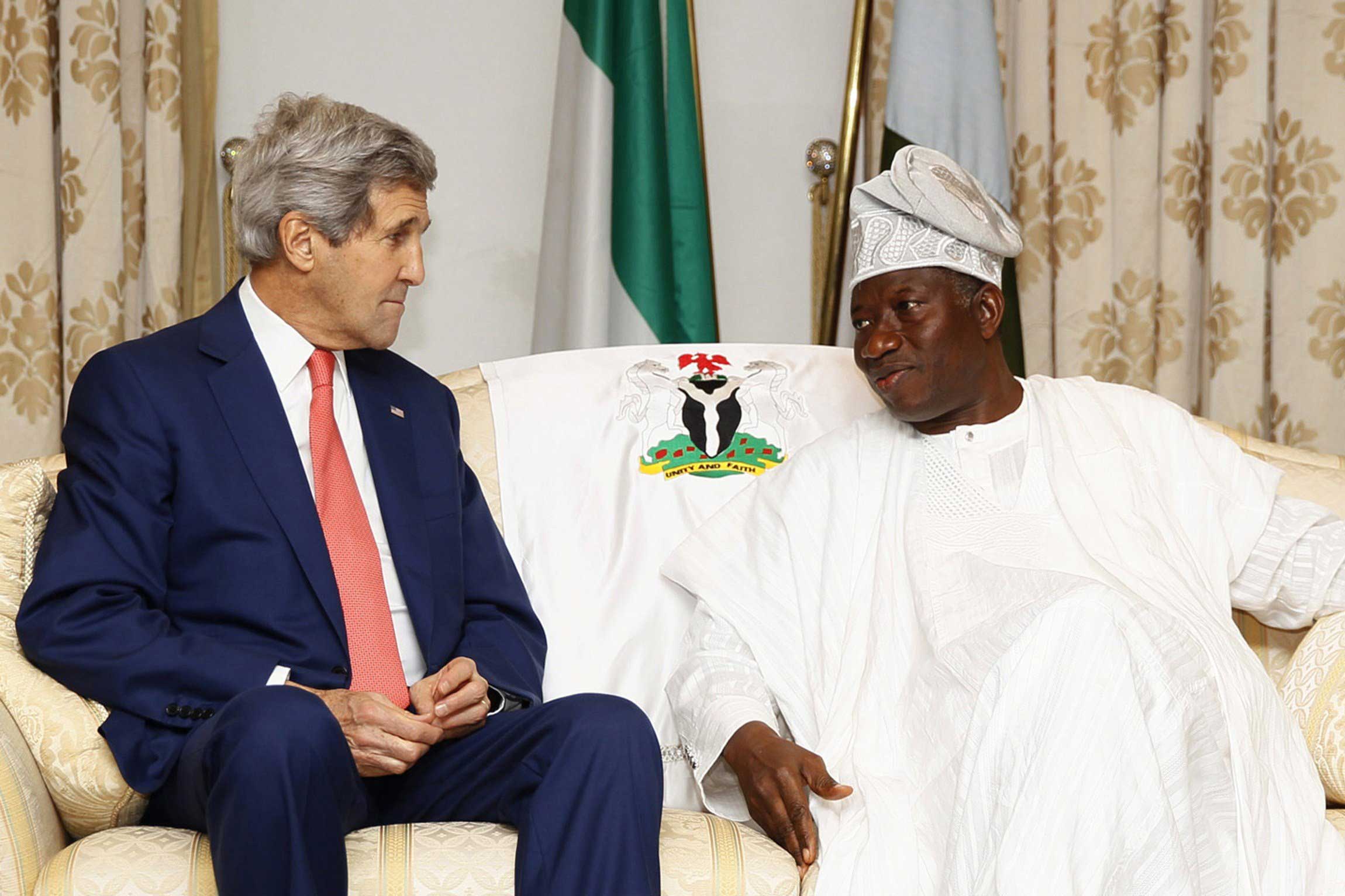 US Secretary of State John Kerry (L) meets with Nigeria's President Goodluck Jonathan to discuss peaceful elections at the State House in Lagos, Nigeria on Jan. 25, 2015. (Akintunde Akinleye—AFP/Getty Images)