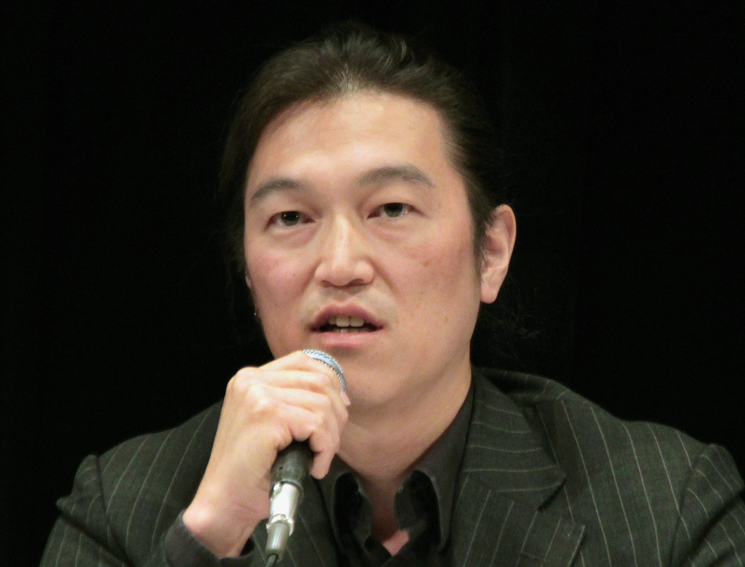 Japanese journalist Kenji Goto delivering a lecture during a symposium in Tokyo on Oct. 27, 2010. (Japan Commitee For The UNICEF/AFP/Getty Images)