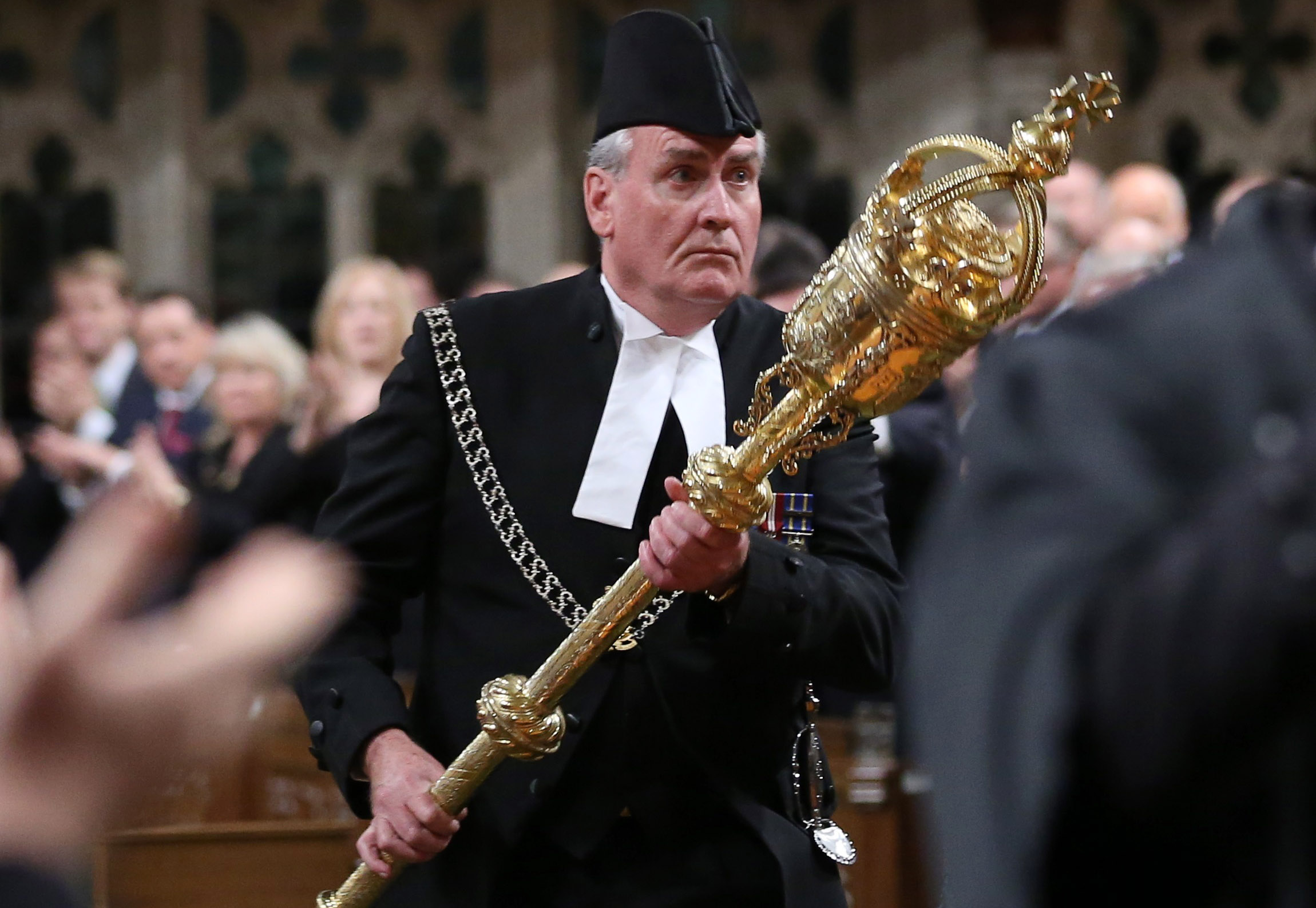 Sergeant-at-Arms Kevin Vickers is applauded in the House of Commons in Ottawa
